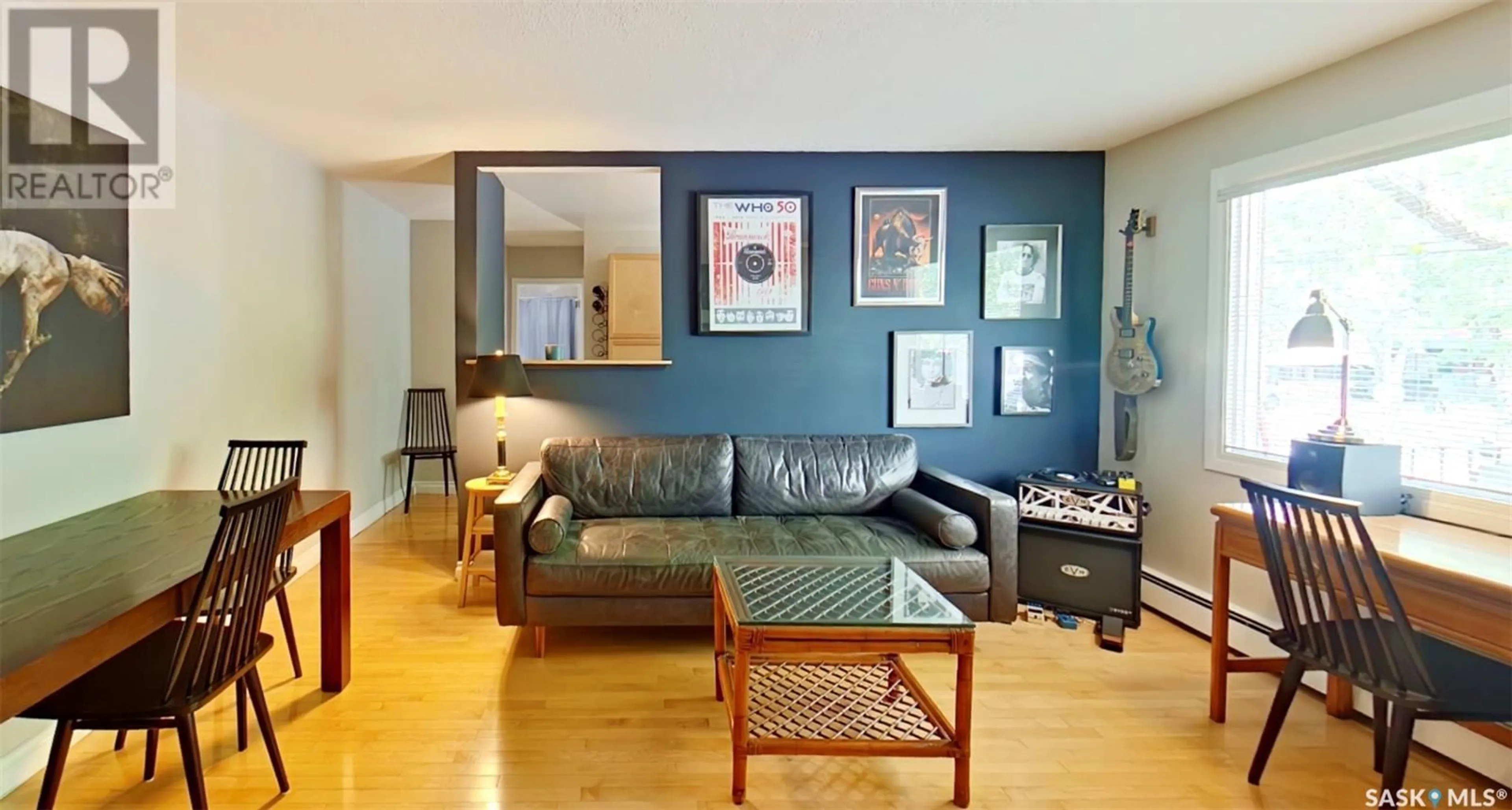 Living room with furniture, wood/laminate floor for 2320 13TH AVENUE, Regina Saskatchewan S4P0V7