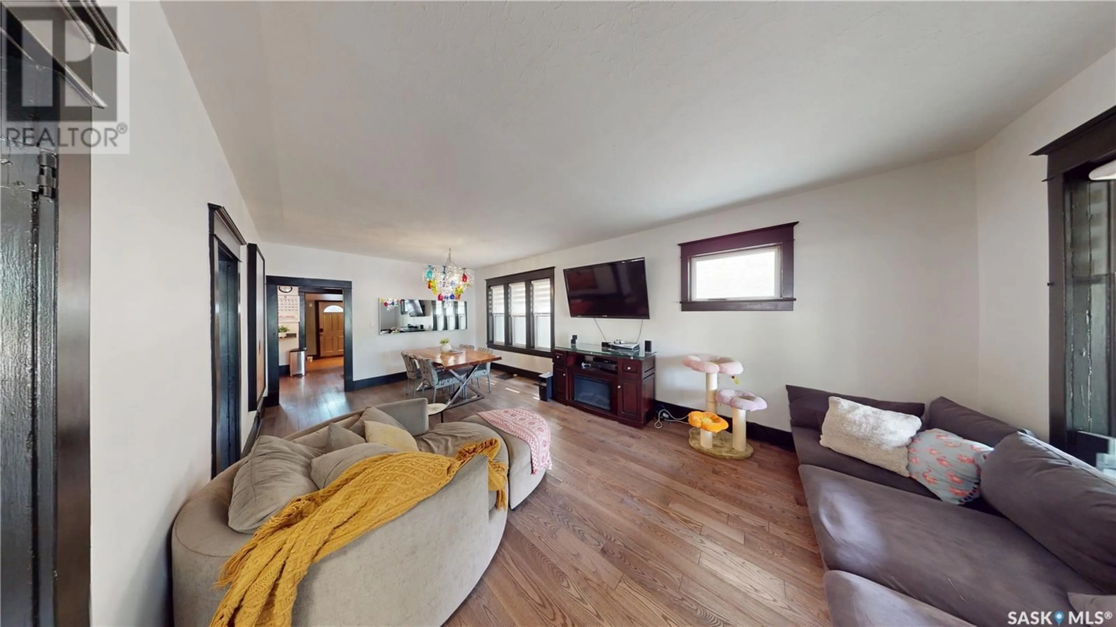 Living room with furniture, wood/laminate floor for 2161 CAMERON STREET, Regina Saskatchewan S4T2V7