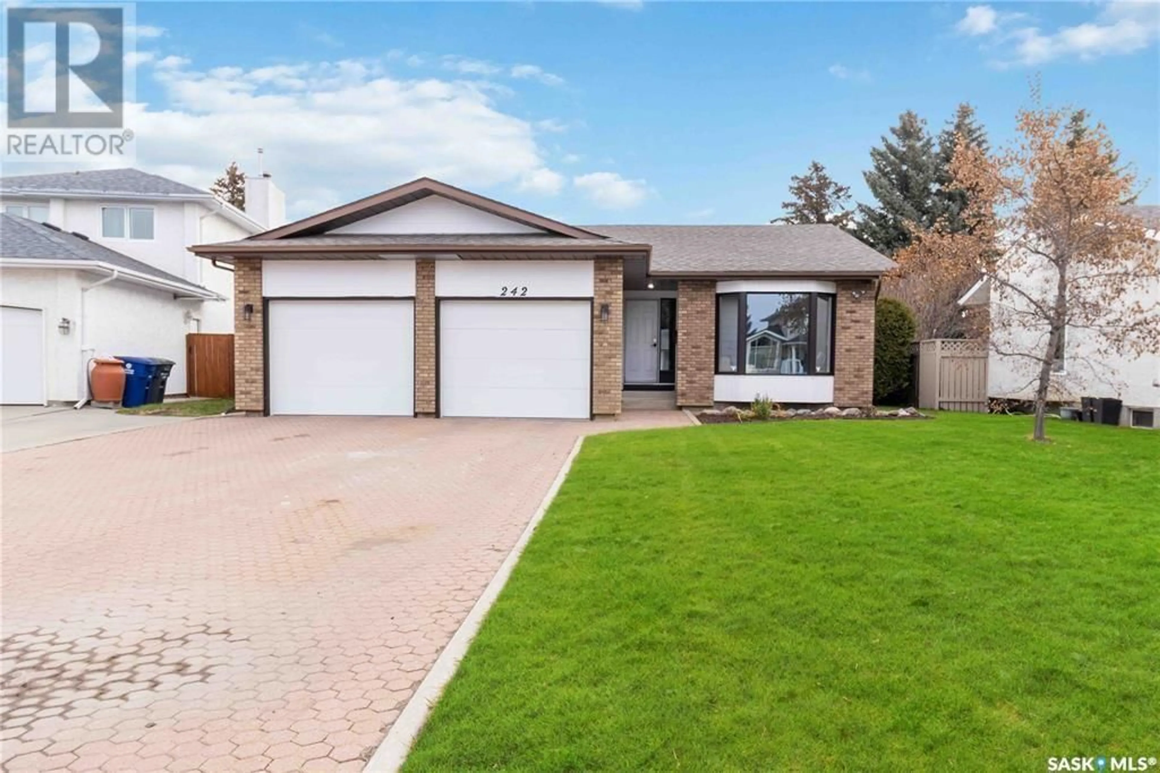 Home with brick exterior material, street for 242 ANGLIN PLACE, Saskatoon Saskatchewan S7J5E9