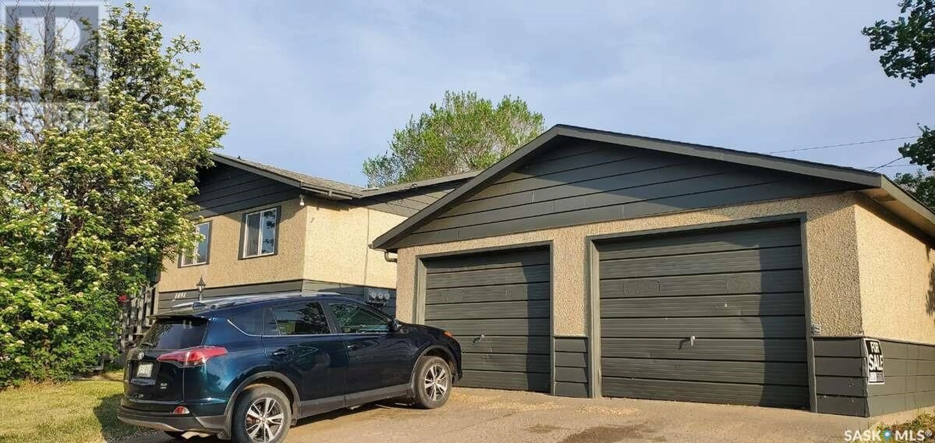 Home with vinyl exterior material, street for 1491 112TH STREET, North Battleford Saskatchewan S9A3B1