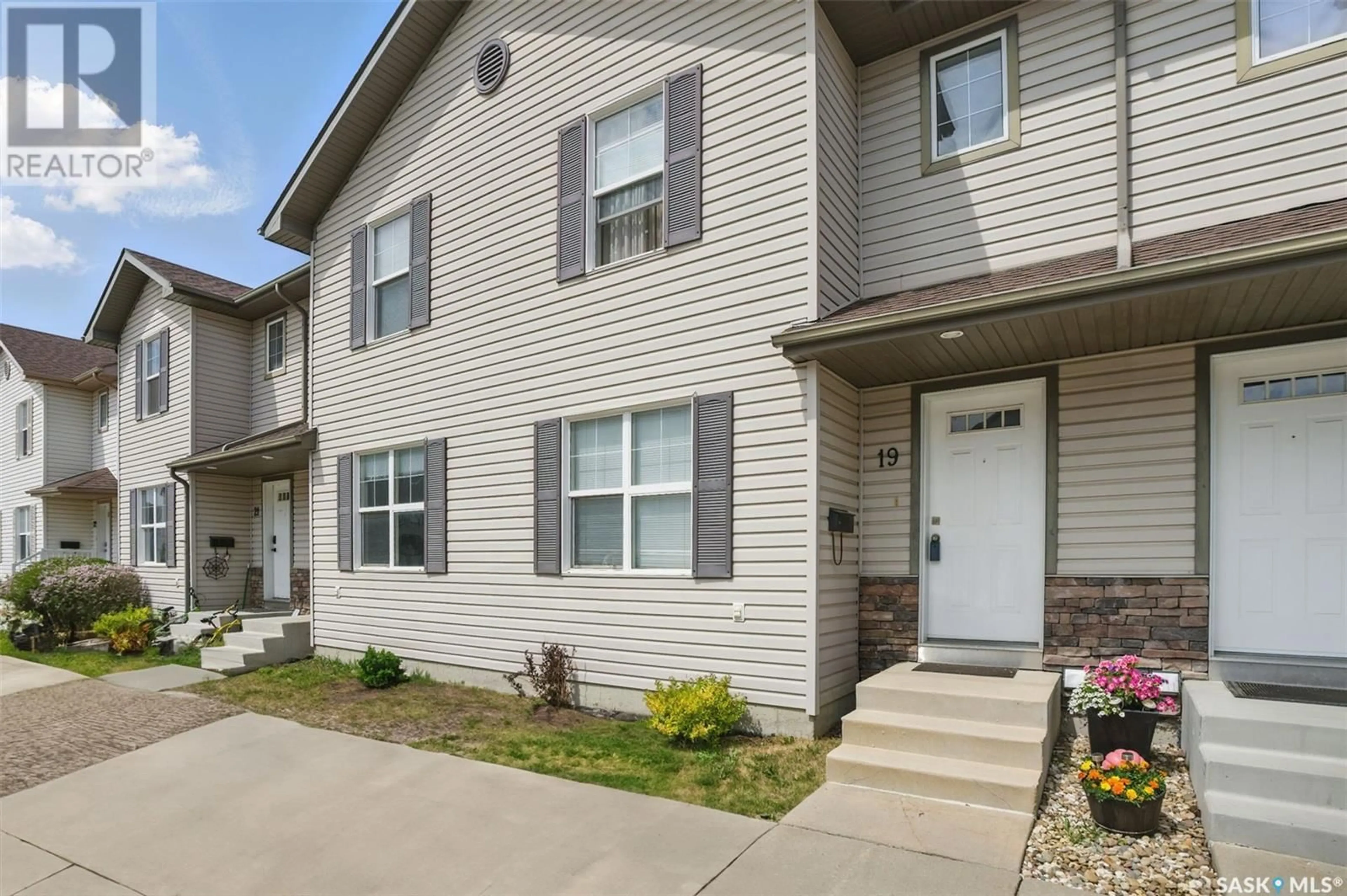 Home with vinyl exterior material, street for 19 135 PAWLYCHENKO LANE, Saskatoon Saskatchewan S7V1J8