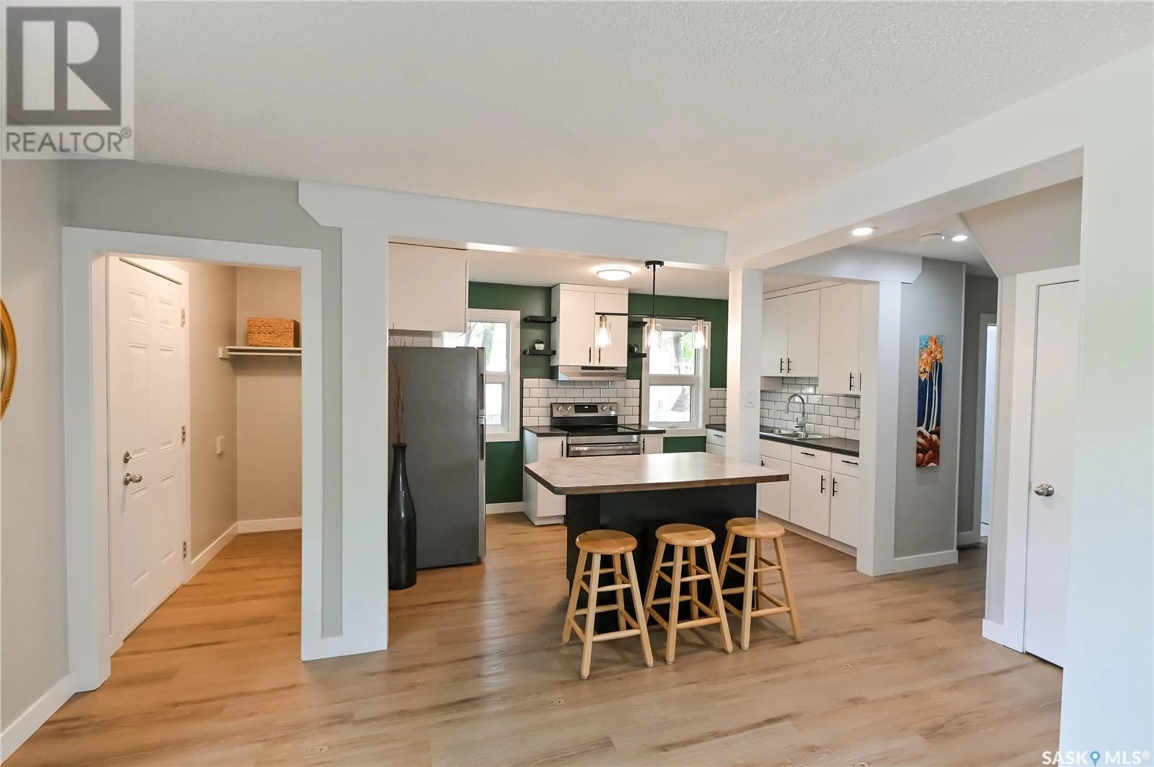 Open concept kitchen, wood/laminate floor for 123 24TH STREET, Prince Albert Saskatchewan S6V1R6
