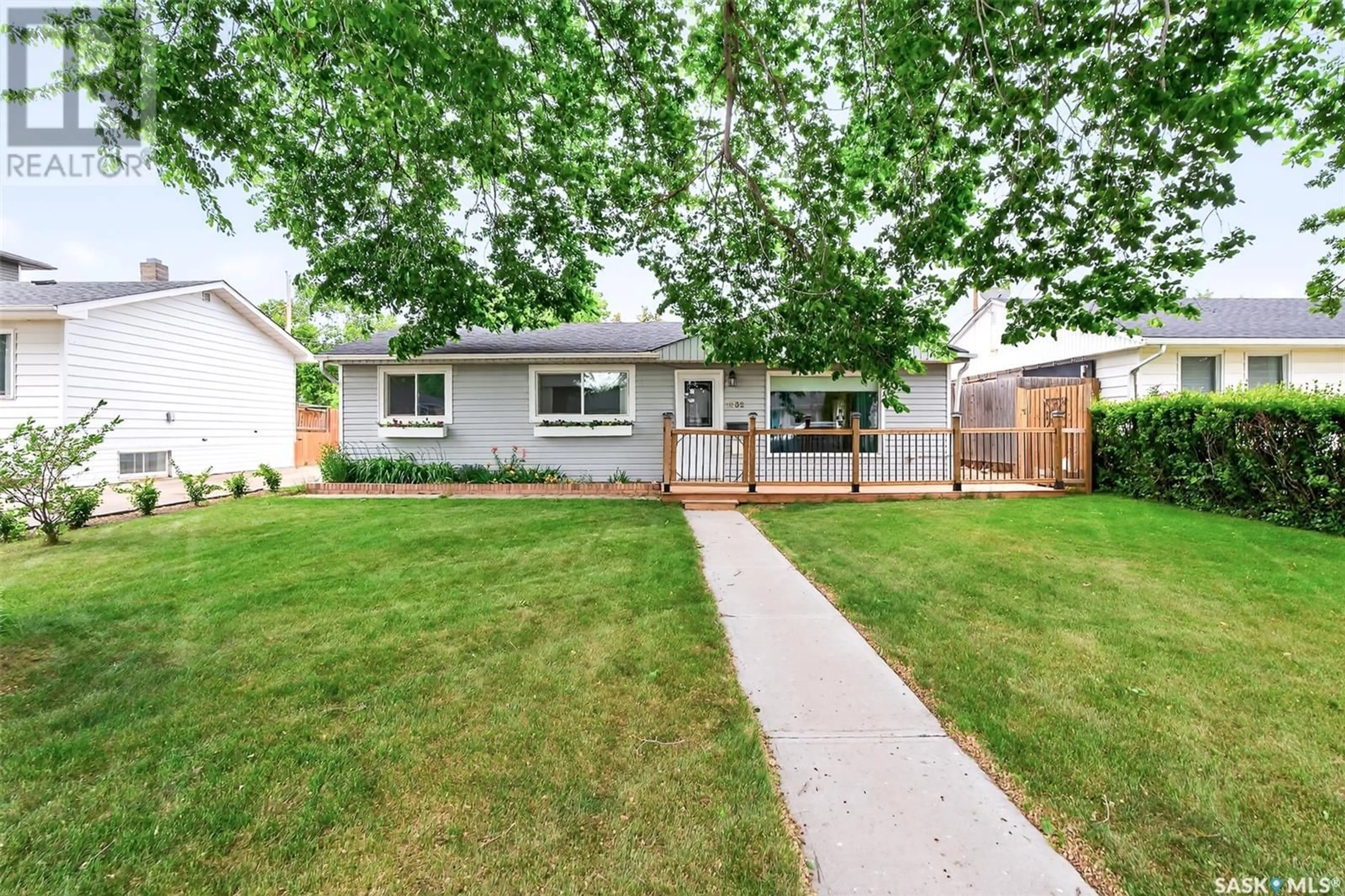 Home with vinyl exterior material, street for 1032 HALL STREET, Moose Jaw Saskatchewan S6H2S6