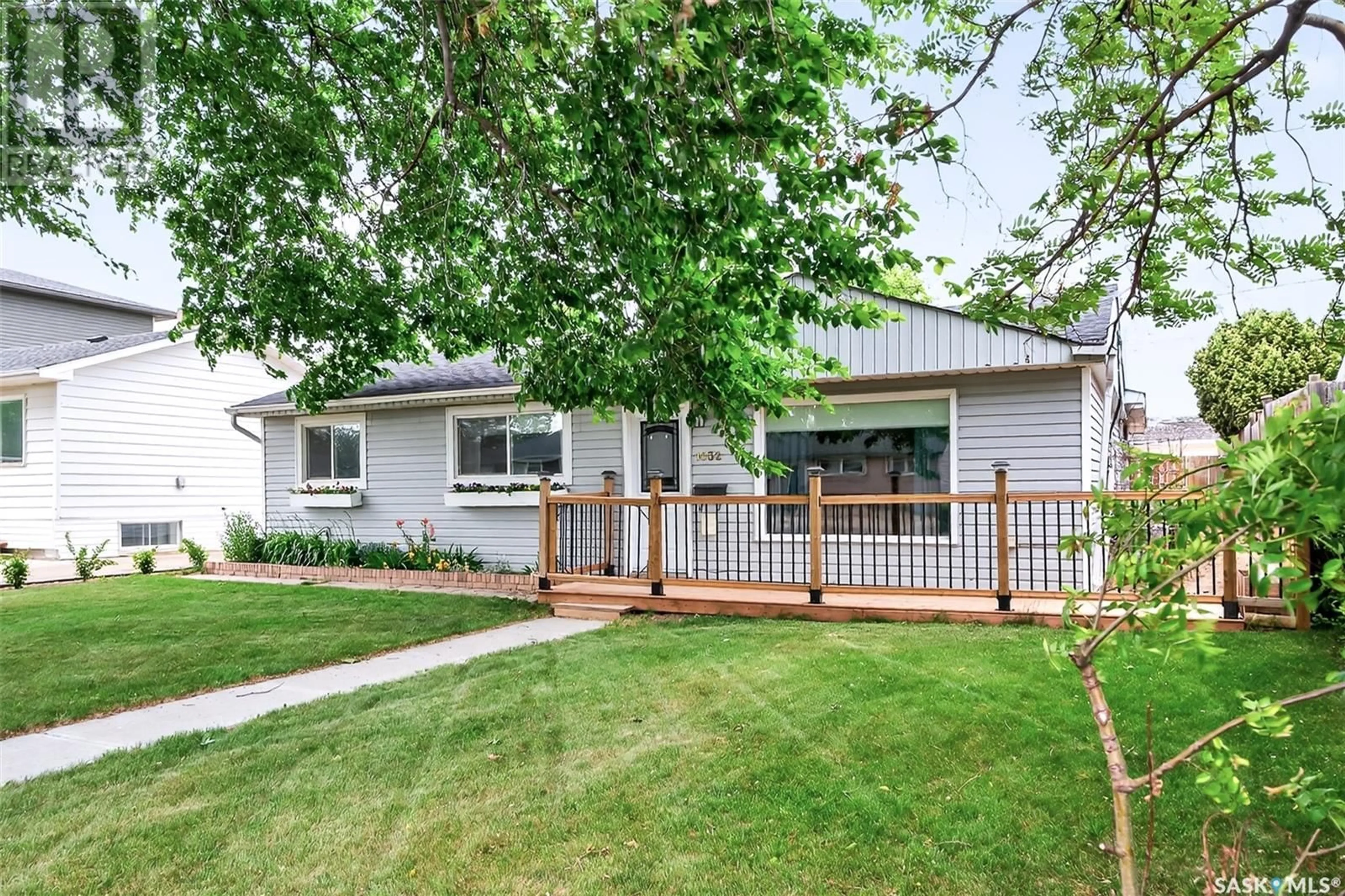 Home with vinyl exterior material, street for 1032 HALL STREET, Moose Jaw Saskatchewan S6H2S6