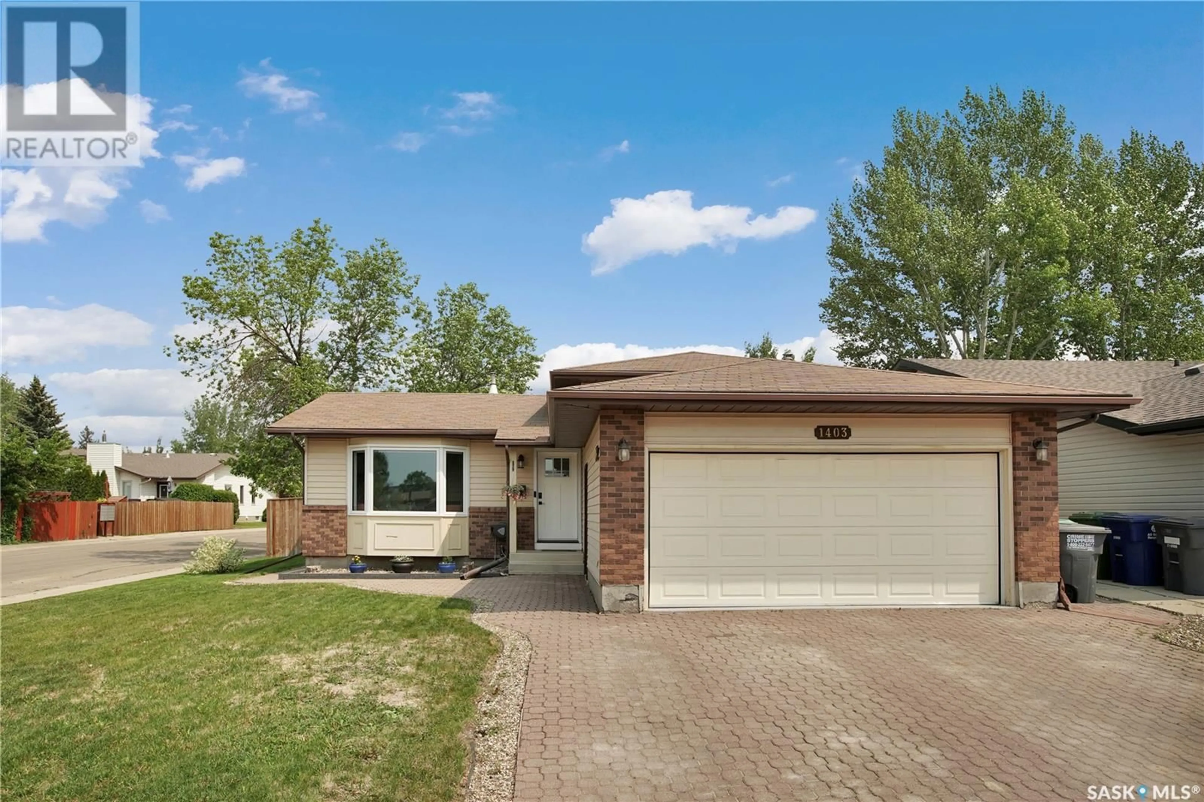 Home with brick exterior material, street for 1403 BRIGHTSAND COURT, Saskatoon Saskatchewan S7J4Y2