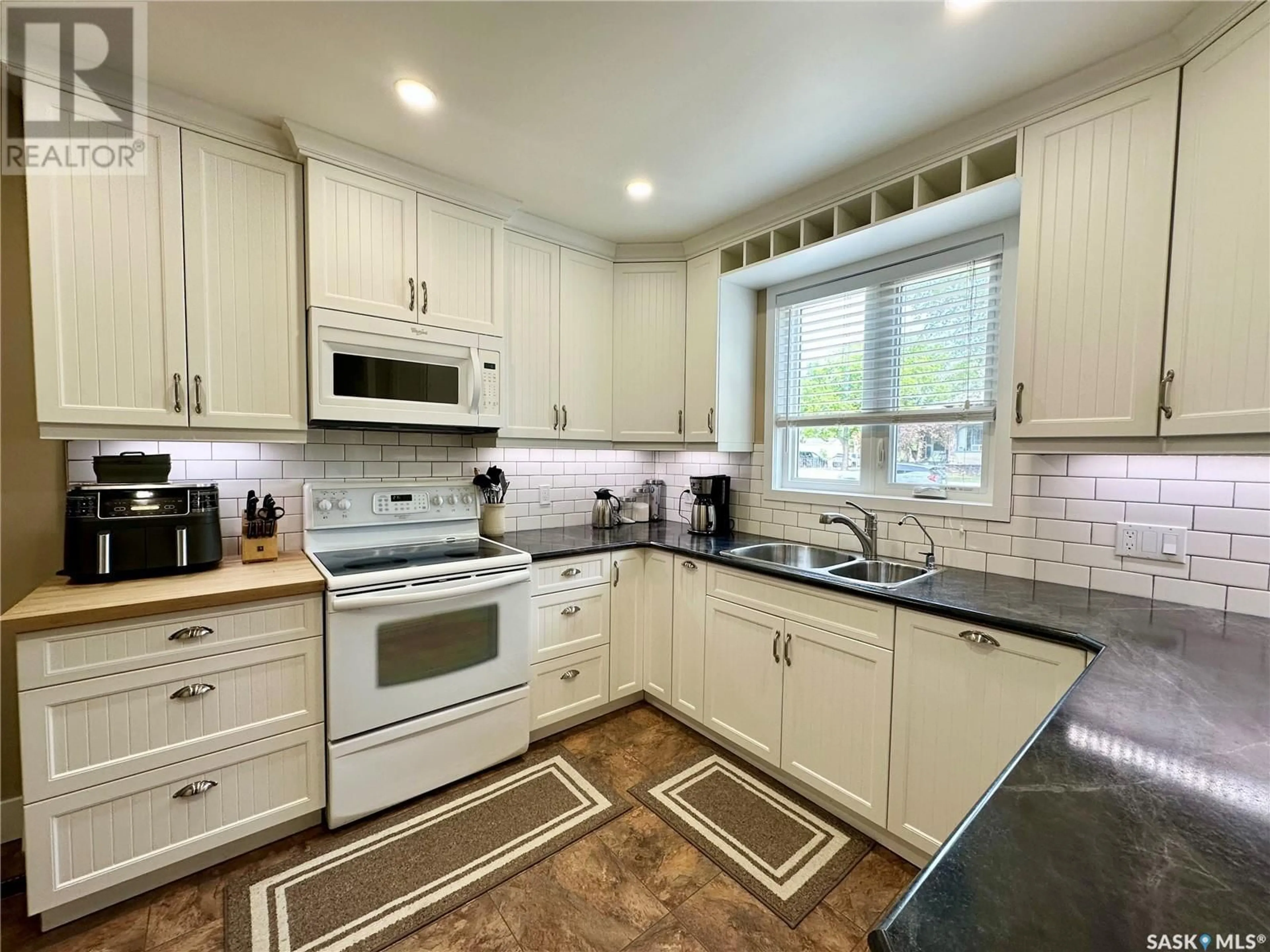 Open concept kitchen, ceramic/tile floor for 1281 98TH STREET, North Battleford Saskatchewan S9A0L8