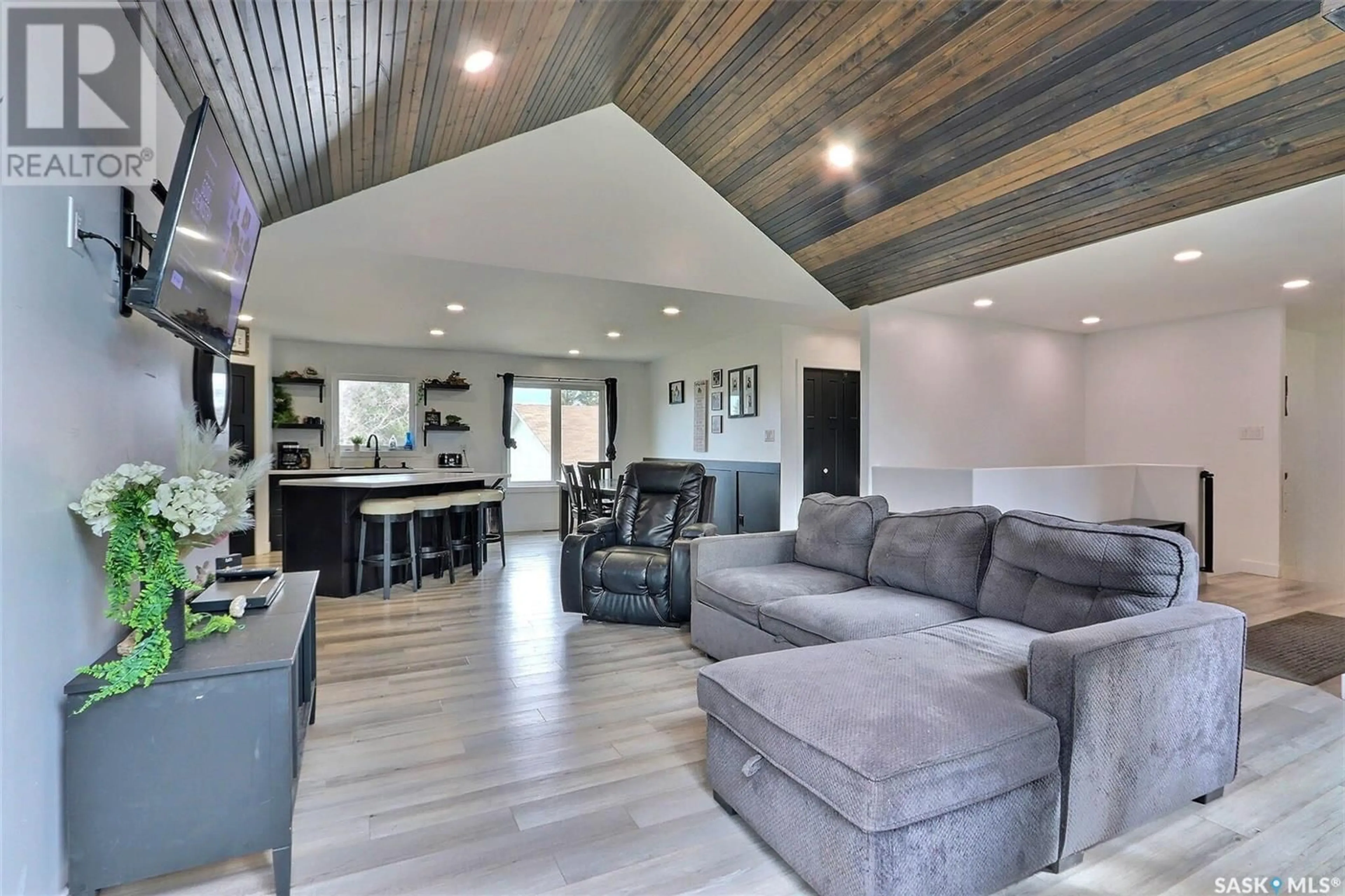 Living room with furniture, wood/laminate floor for 105 4TH STREET, Birch Hills Saskatchewan S0J0G0