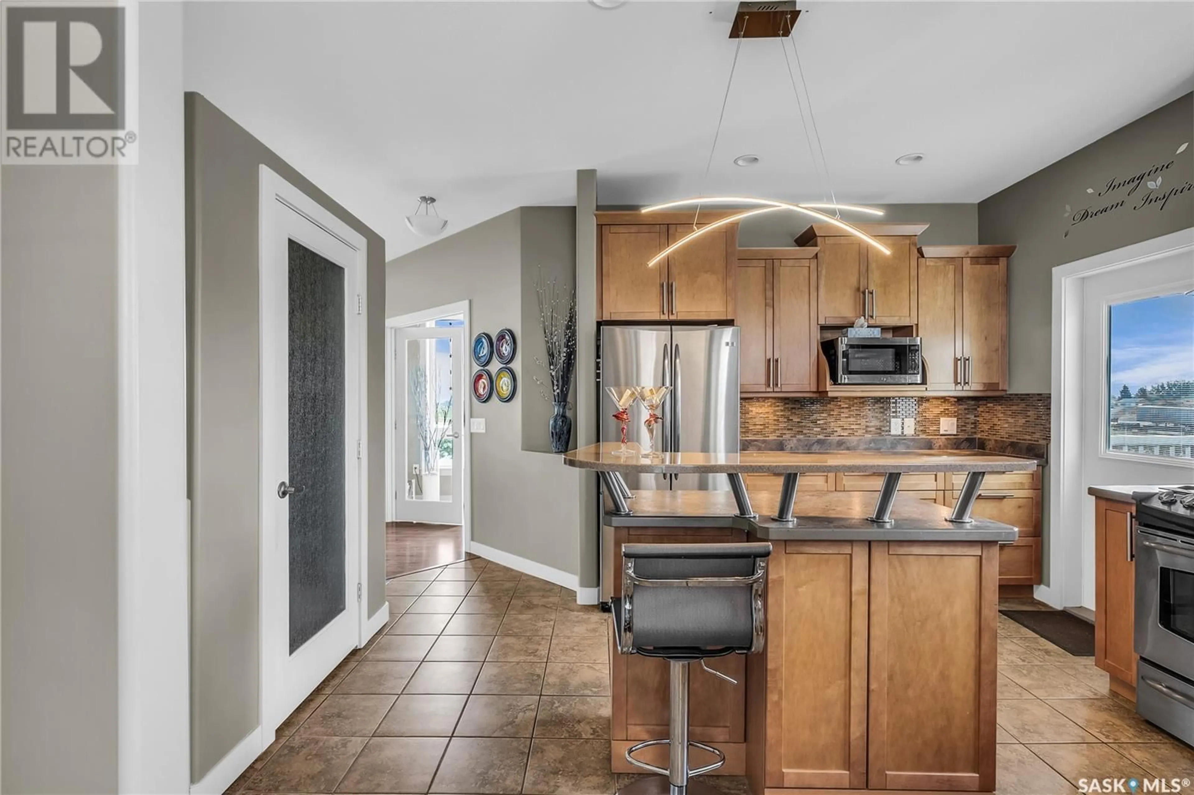 Open concept kitchen, ceramic/tile floor for 904 WATER RIDGE CRESCENT, Humboldt Saskatchewan S0K2A0