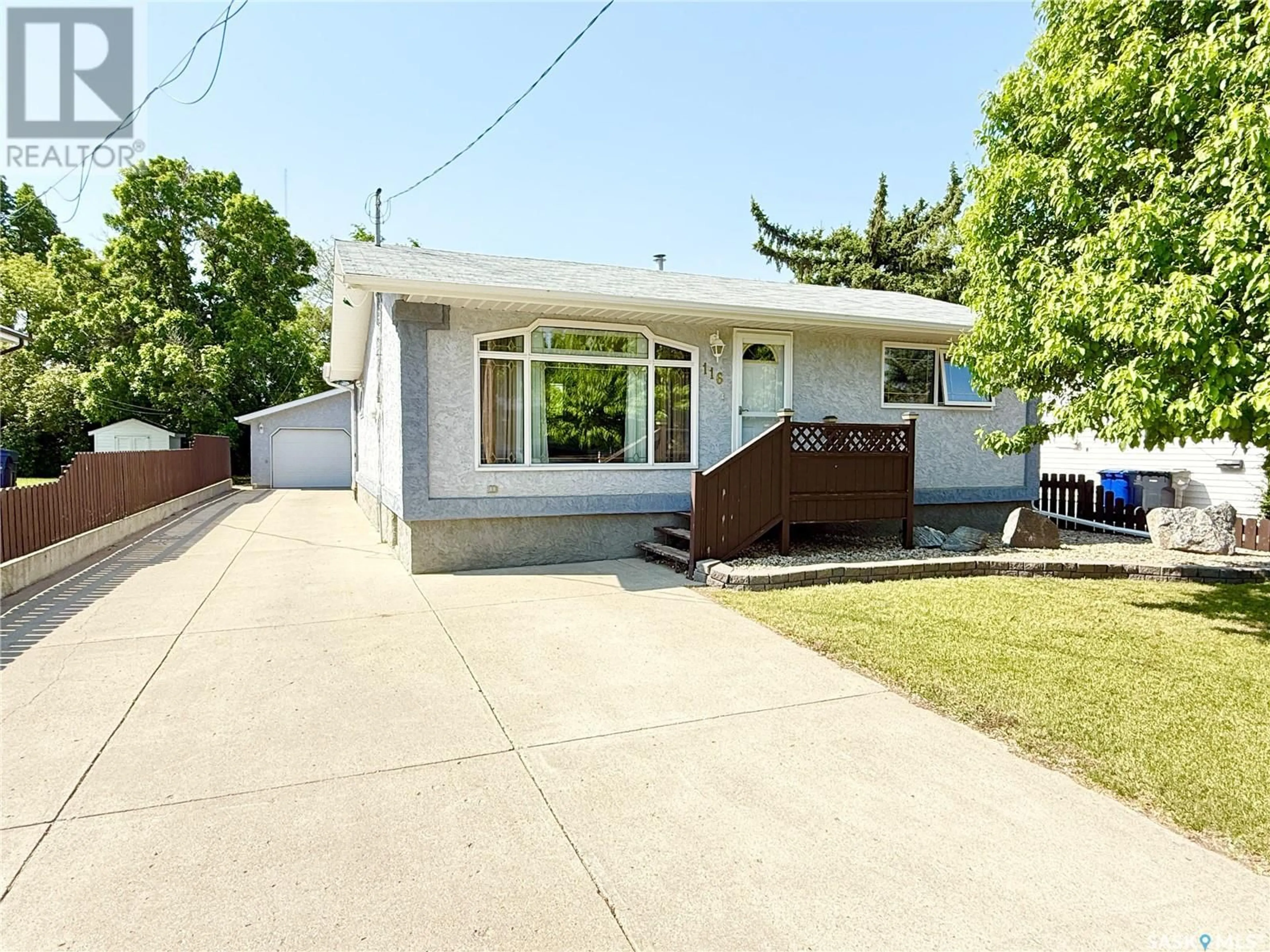 Home with vinyl exterior material, street for 116 7TH AVENUE, Weyburn Saskatchewan S4H1Z2