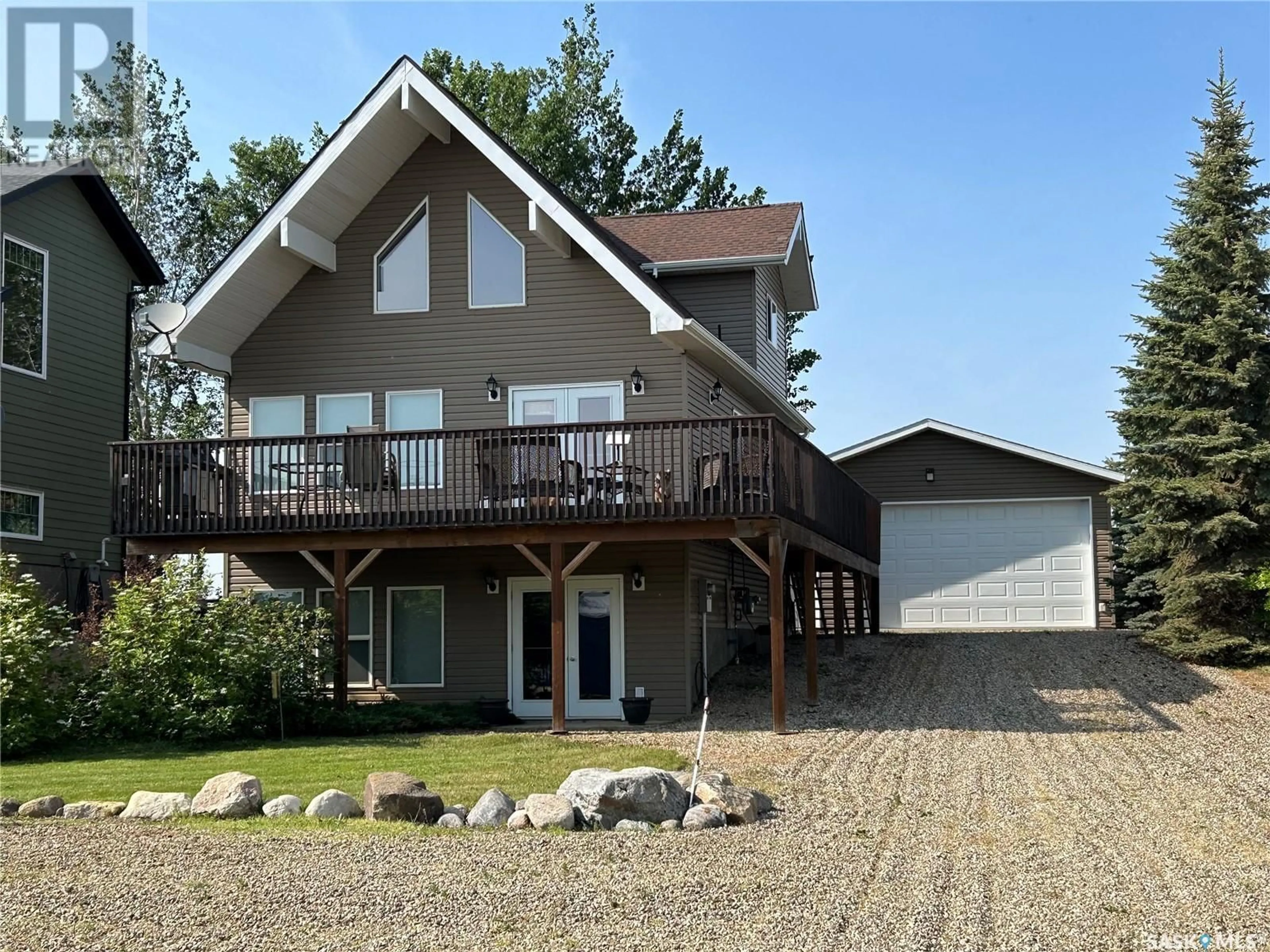 Home with vinyl exterior material, unknown for 104 SUNRIDGE ROAD, Pebble Baye Saskatchewan S0J2G0