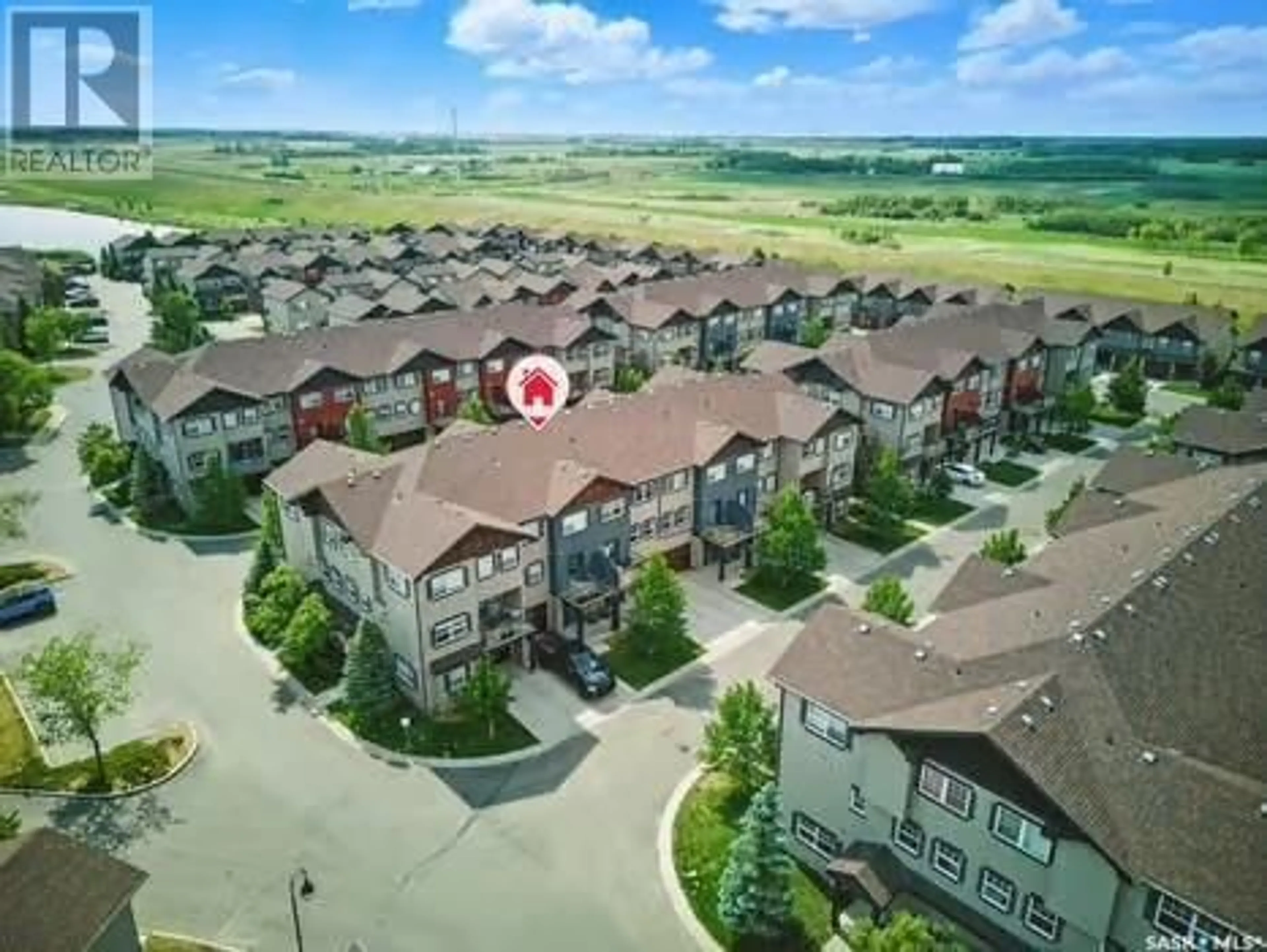 A pic from outside/outdoor area/front of a property/back of a property/a pic from drone, mountain view for 542 150 LANGLOIS WAY, Saskatoon Saskatchewan S7T0K9