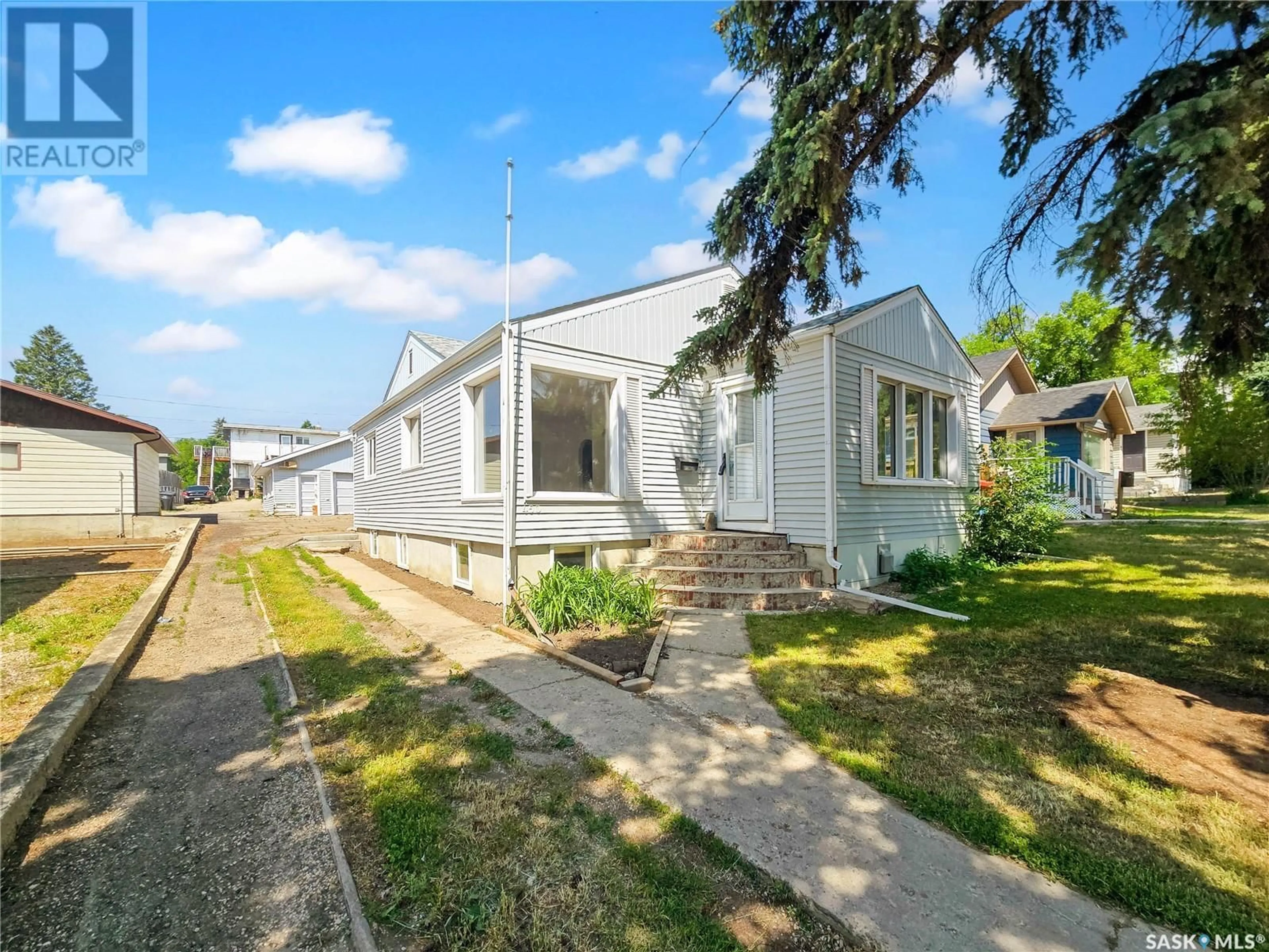 A pic from outside/outdoor area/front of a property/back of a property/a pic from drone, street for 450 CENTRAL AVENUE, Swift Current Saskatchewan S9H0L7