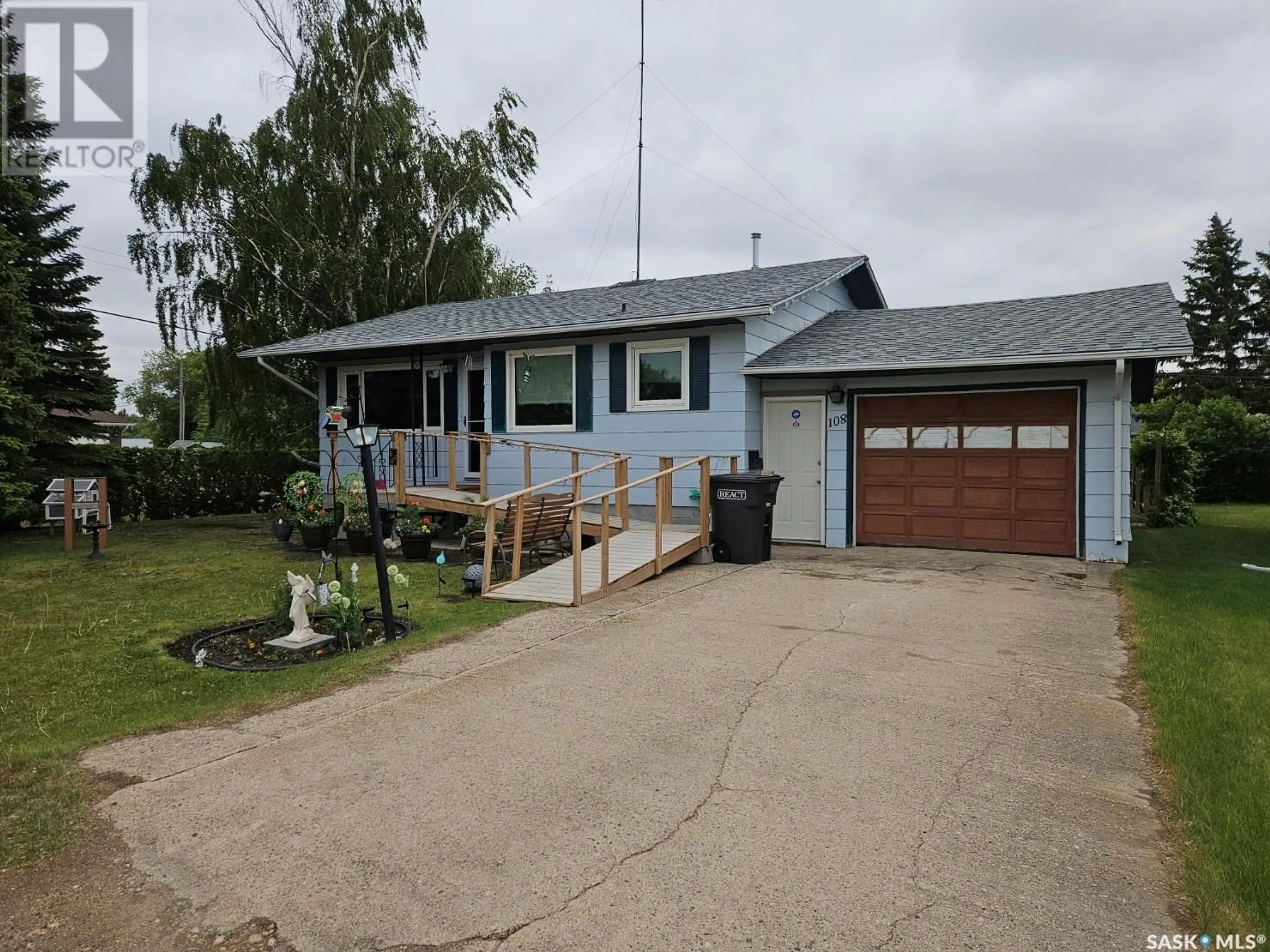 Home with vinyl exterior material, street for 108 PHILLIPS STREET, Muenster Saskatchewan S0K2Y0