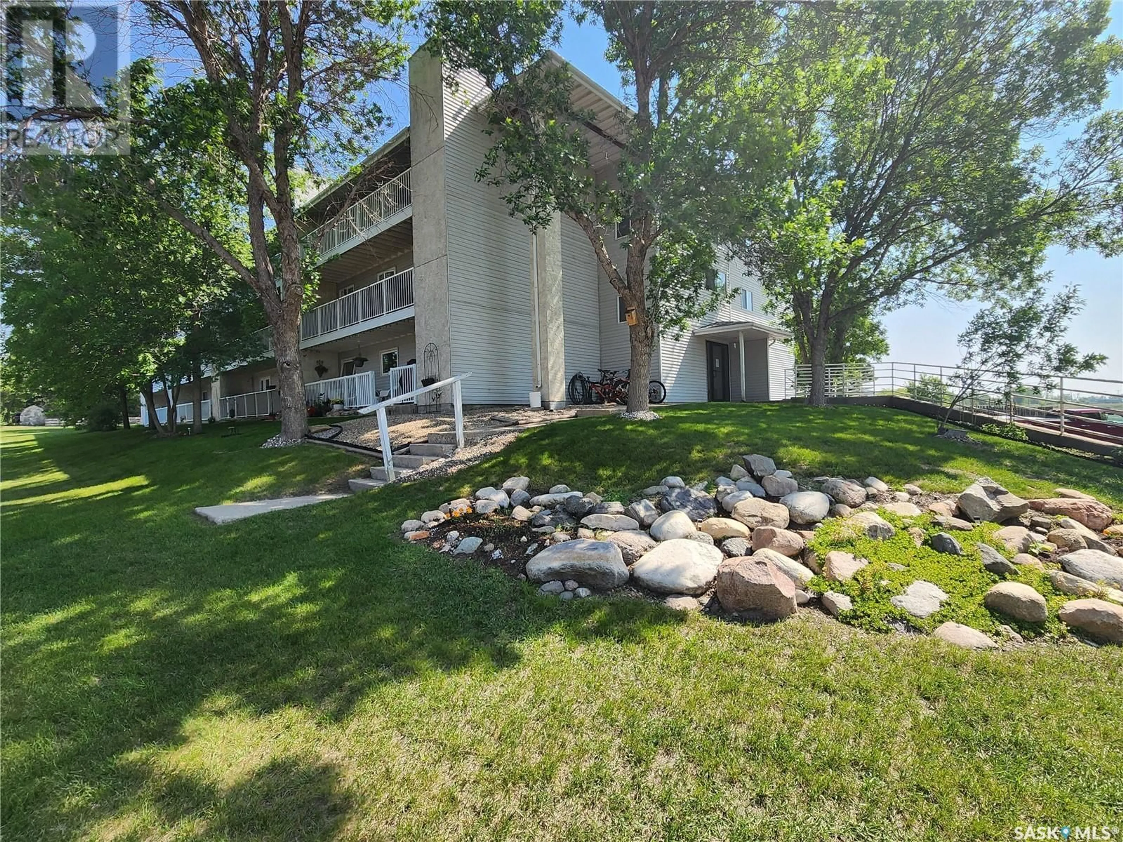 A pic from outside/outdoor area/front of a property/back of a property/a pic from drone, water/lake/river/ocean view for 306 - 208 PERKINS STREET, Estevan Saskatchewan S4A2K1