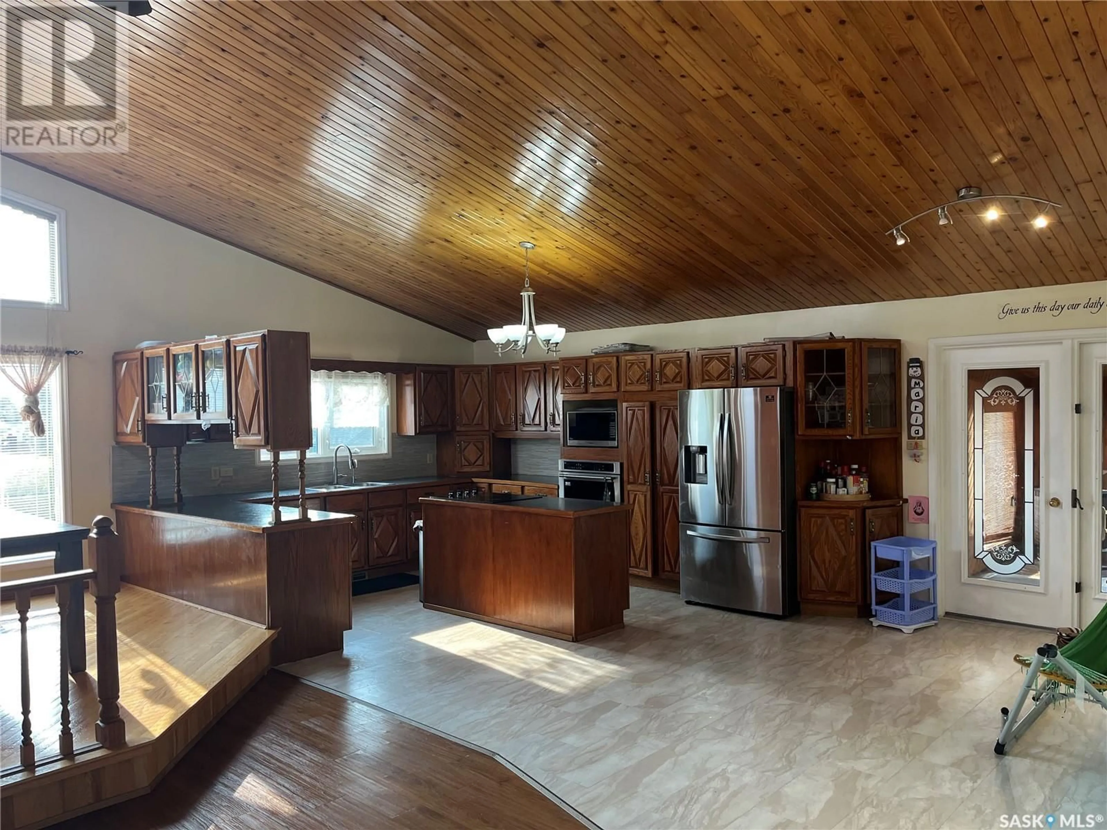 Open concept kitchen, wood/laminate floor for 3082 SHERMAN DRIVE, Prince Albert Saskatchewan S6V7H6