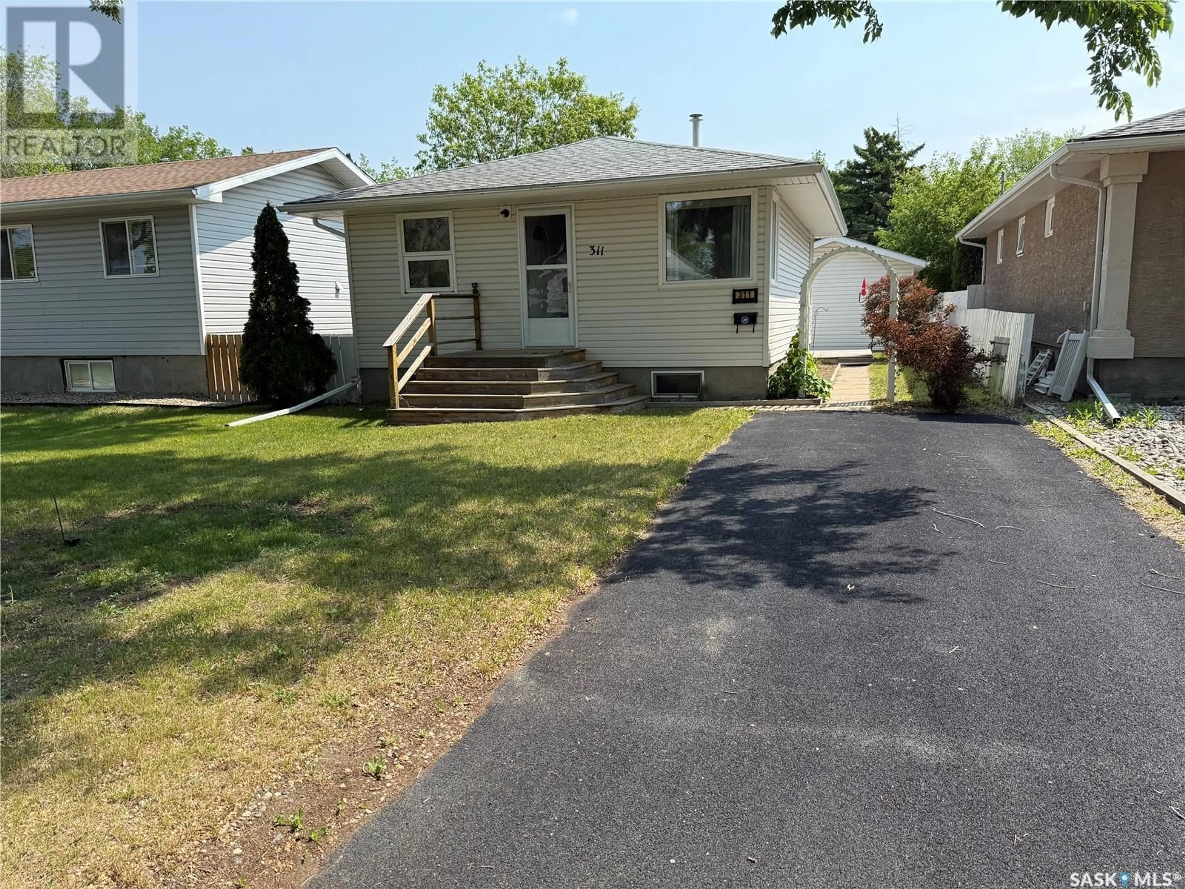 Home with vinyl exterior material, street for 311 ROBINSON STREET, Regina Saskatchewan S4R3R3