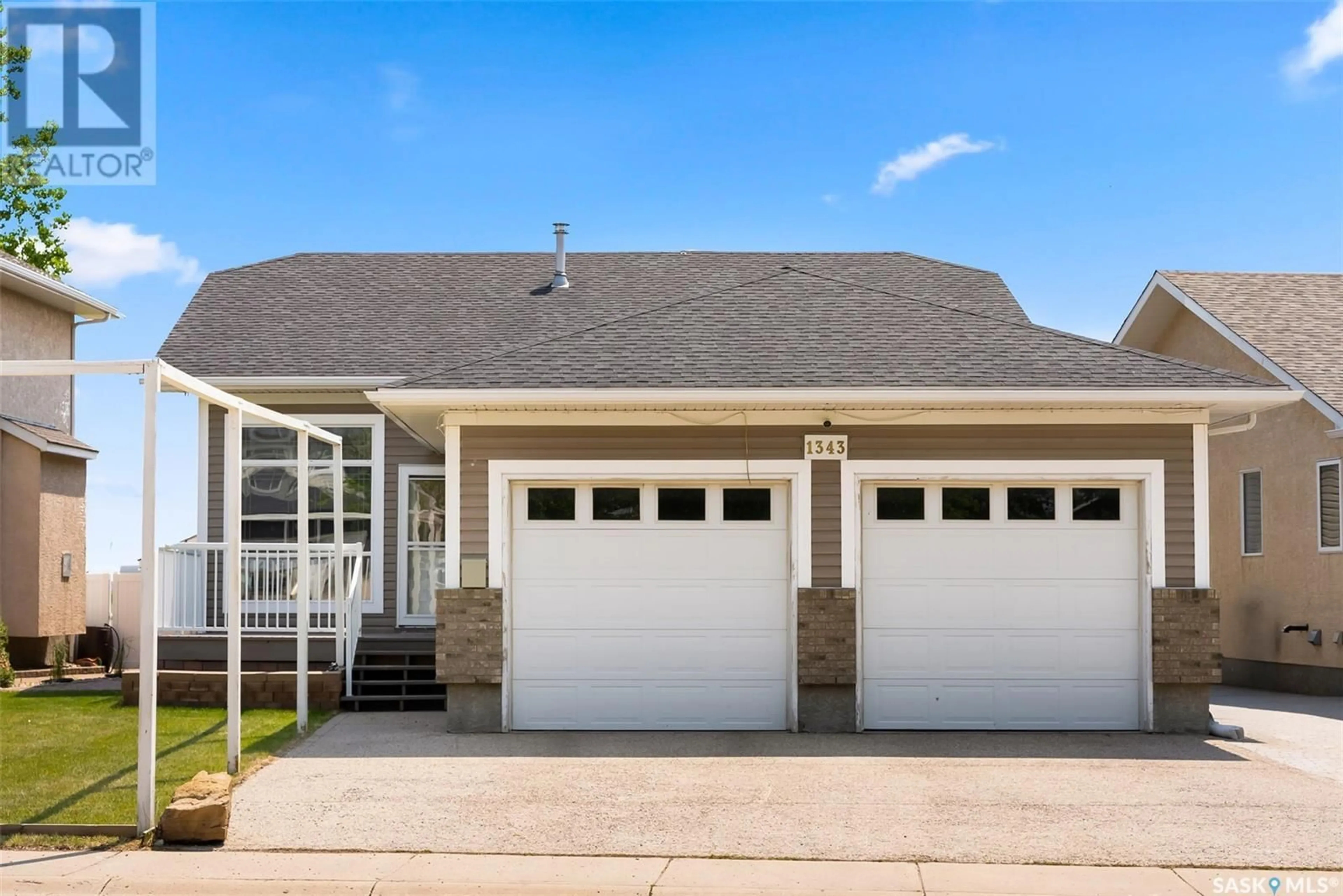 Home with vinyl exterior material, street for 1343 CHATWIN CRESCENT, Regina Saskatchewan S4N7N8