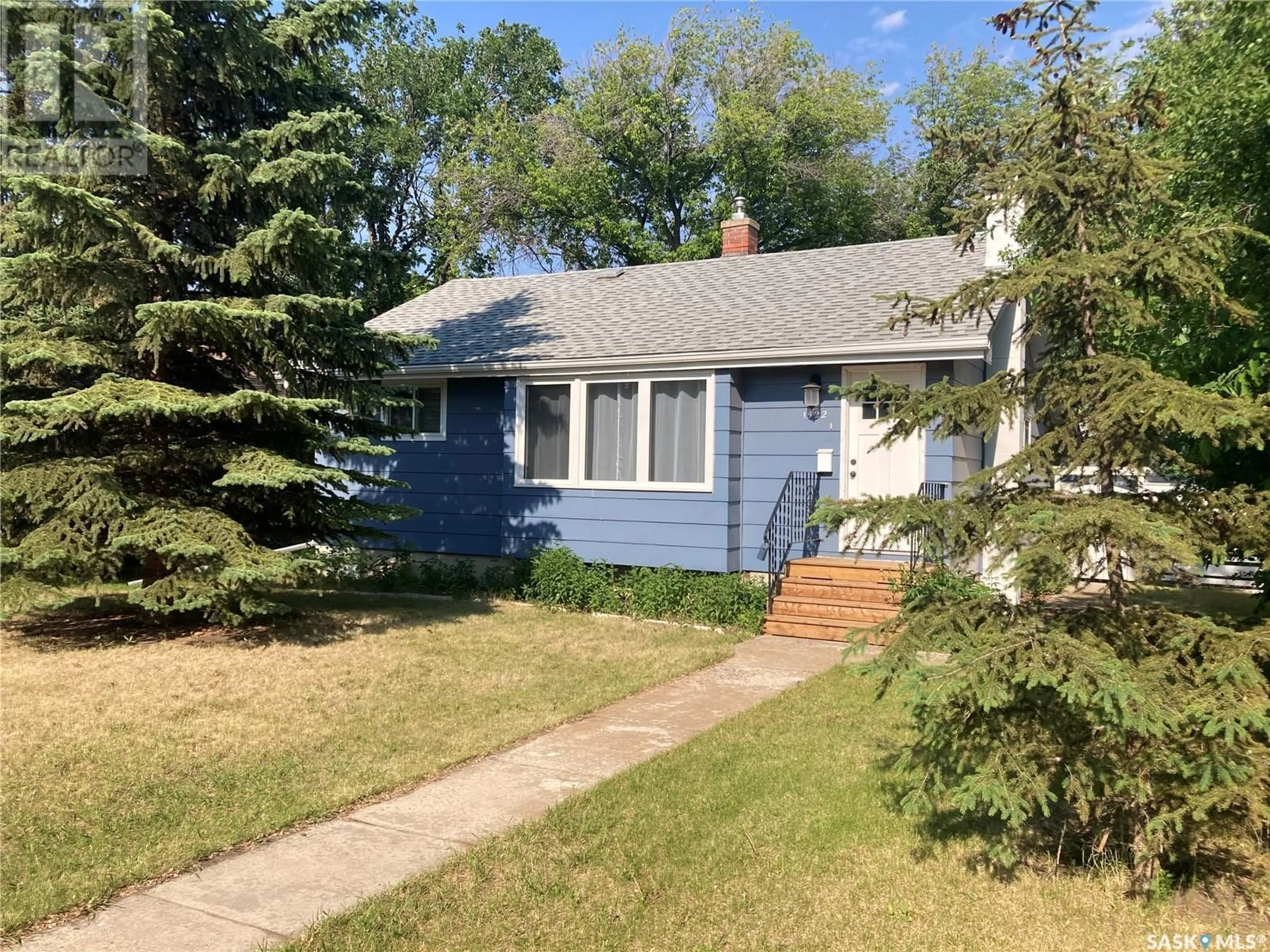 Home with vinyl exterior material, street for 1522 10TH AVENUE, Saskatoon Saskatchewan S7K3A8