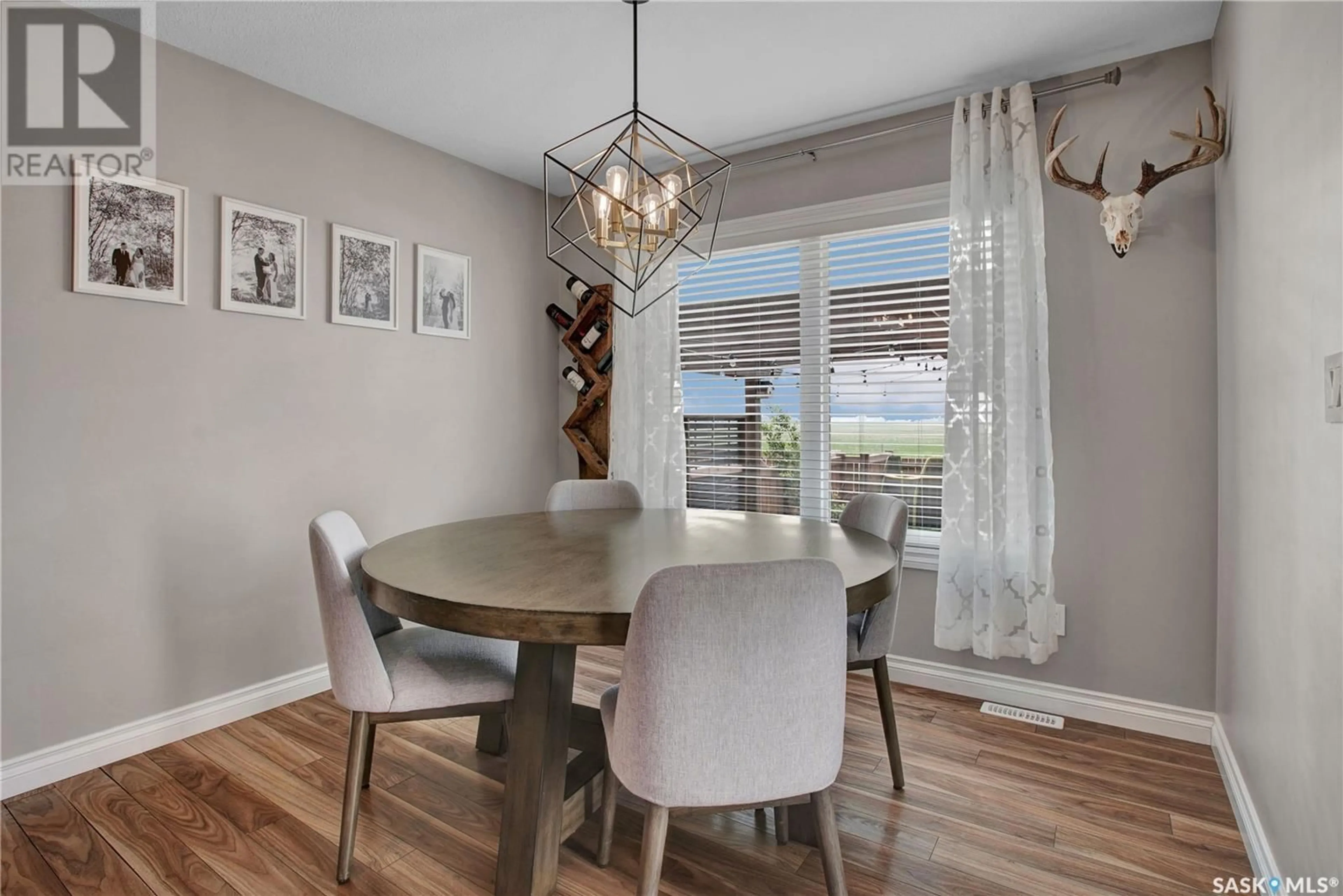 Dining room, wood/laminate floor for 513 MAPLE CRESCENT, Warman Saskatchewan S0K4S2