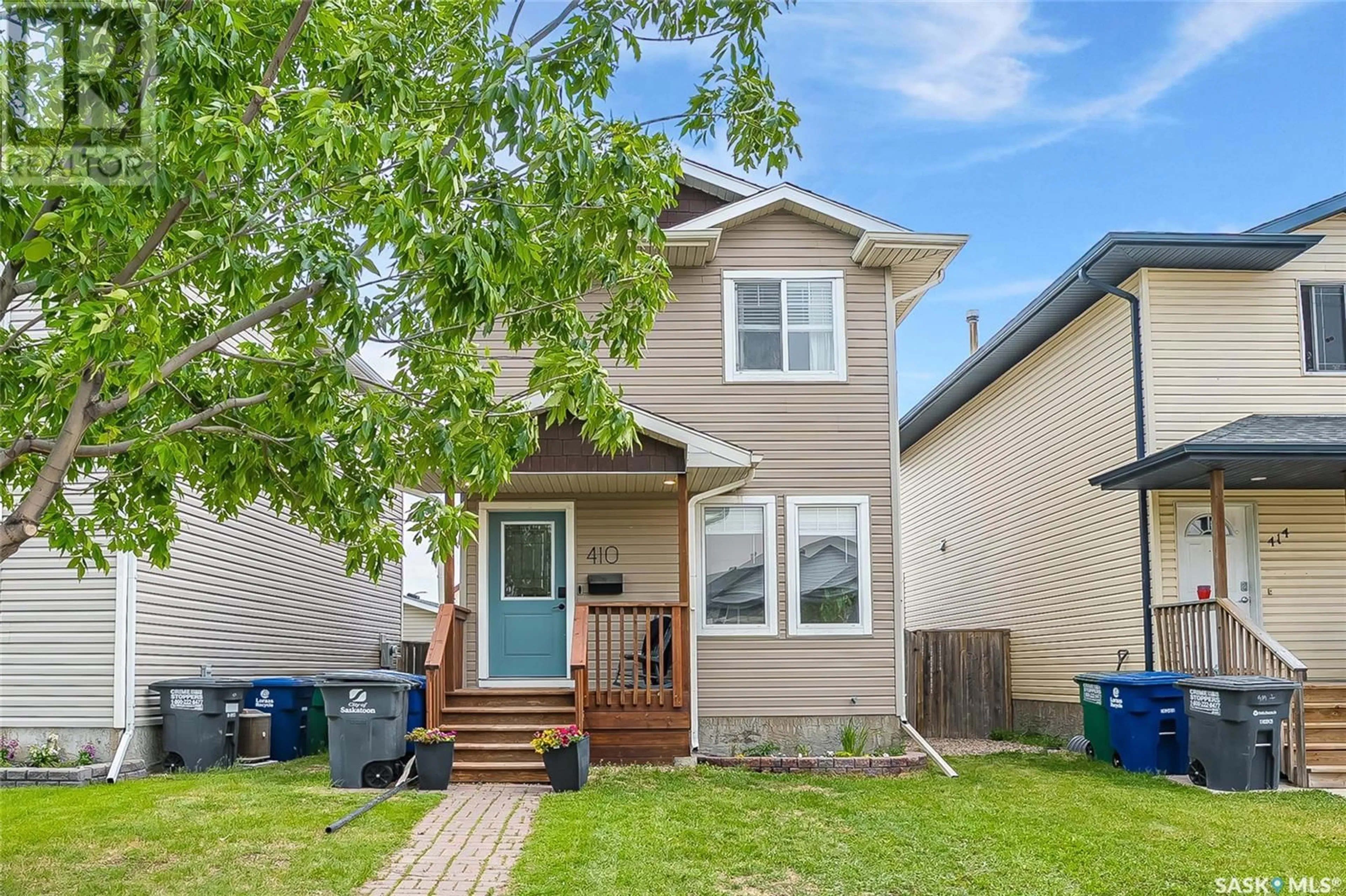 Home with vinyl exterior material, street for 410 RUTHERFORD CRESCENT, Saskatoon Saskatchewan S7N4X7