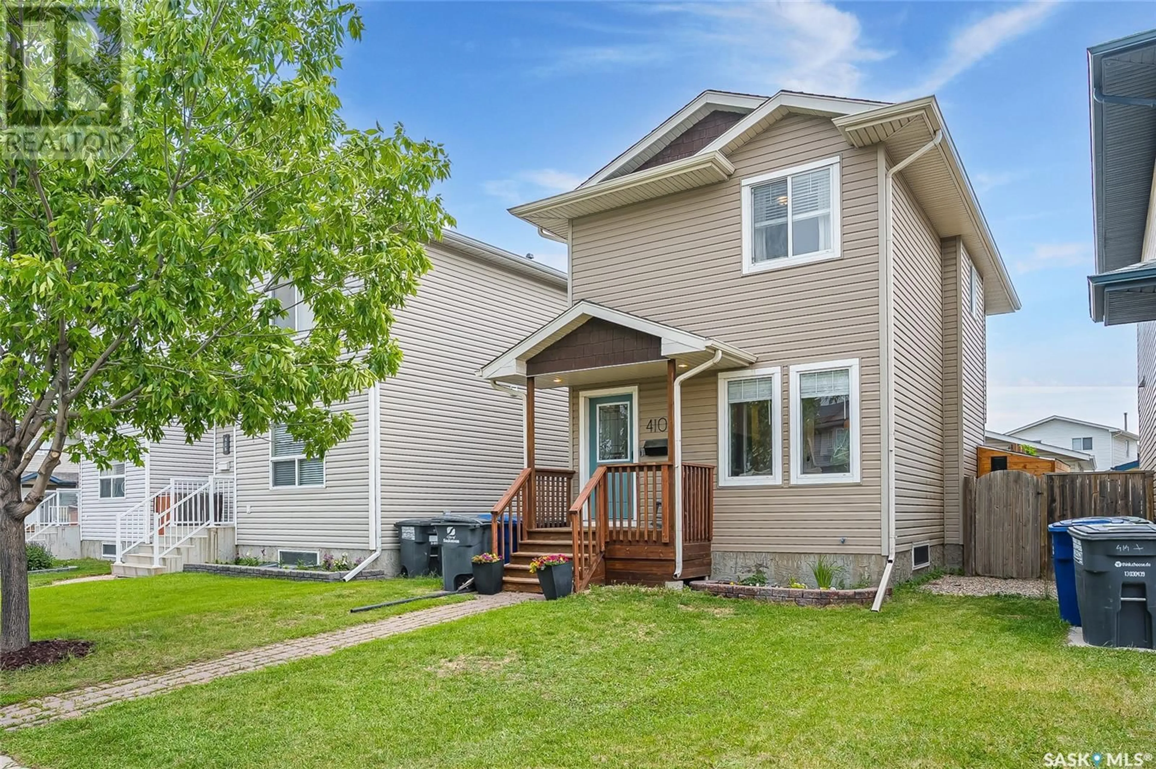 Home with vinyl exterior material, street for 410 RUTHERFORD CRESCENT, Saskatoon Saskatchewan S7N4X7