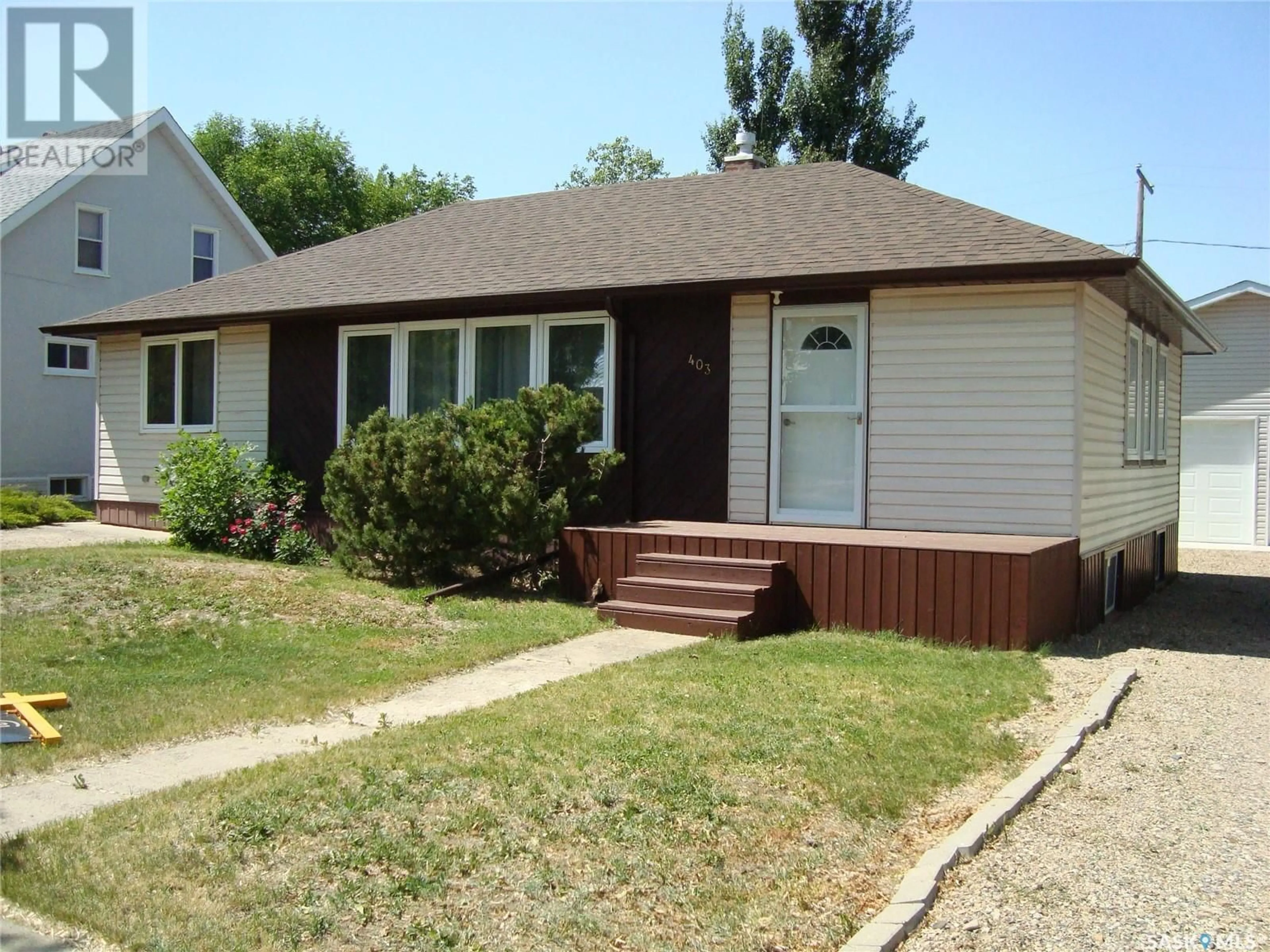 Home with vinyl exterior material, street for 403 CENTRE STREET, Cabri Saskatchewan S0N0J0