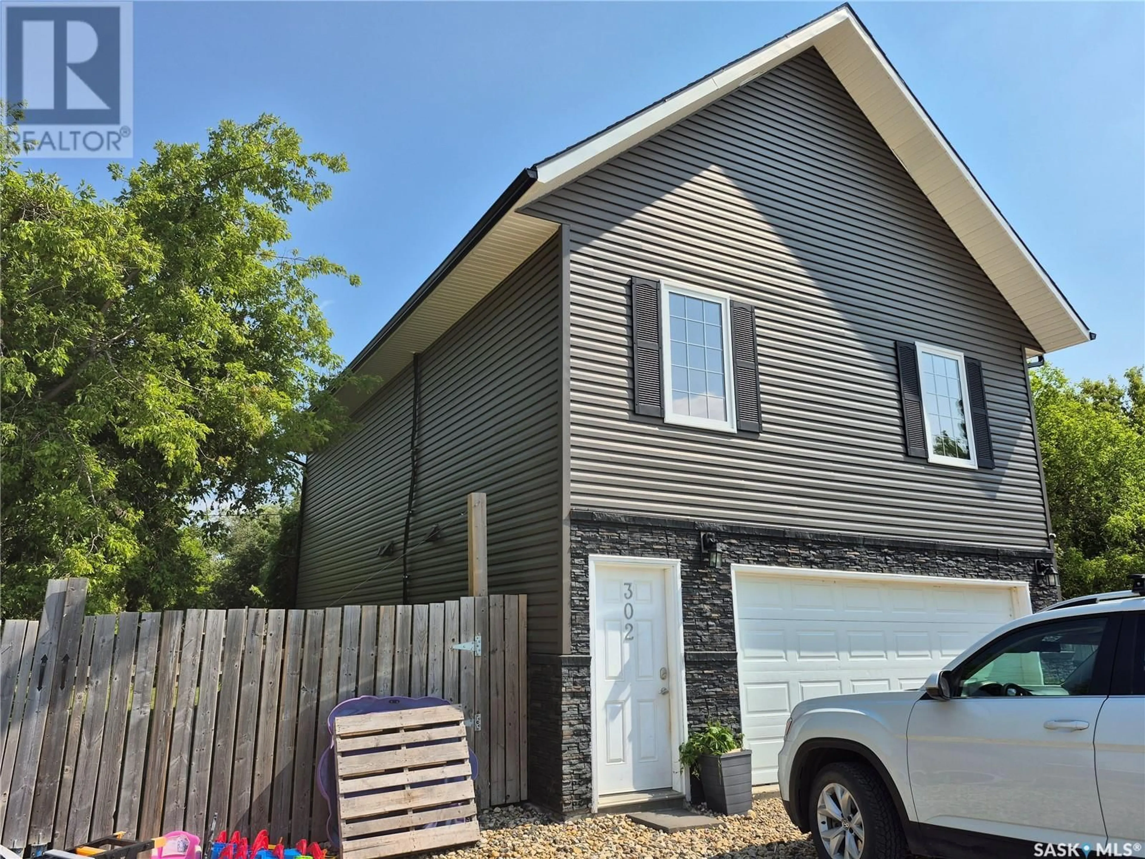 Home with vinyl exterior material, street for 302 MARTIN STREET, Pangman Saskatchewan S0C2C0