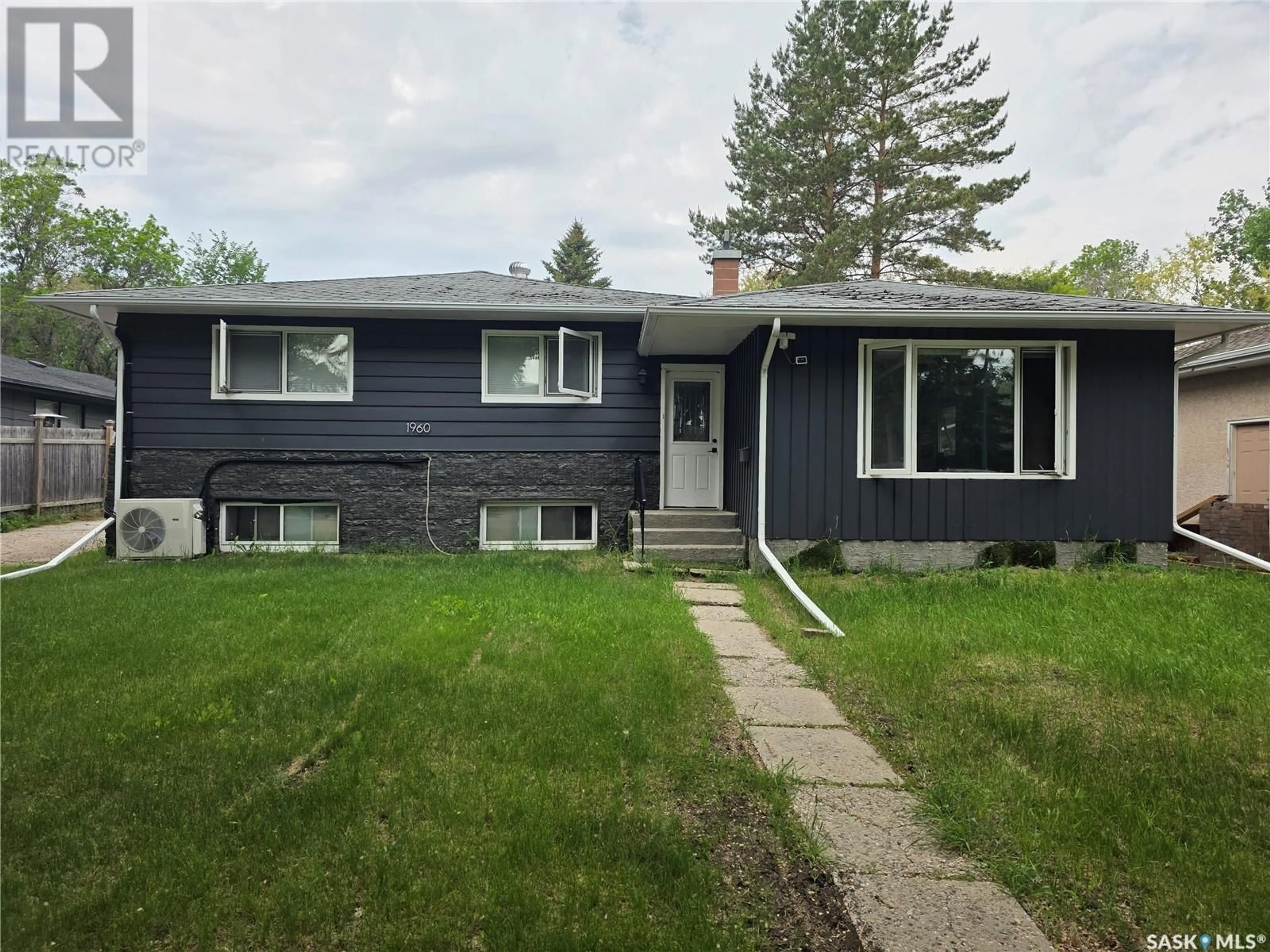 Home with vinyl exterior material, street for 1960 COWAN CRESCENT, Regina Saskatchewan S4S4C6