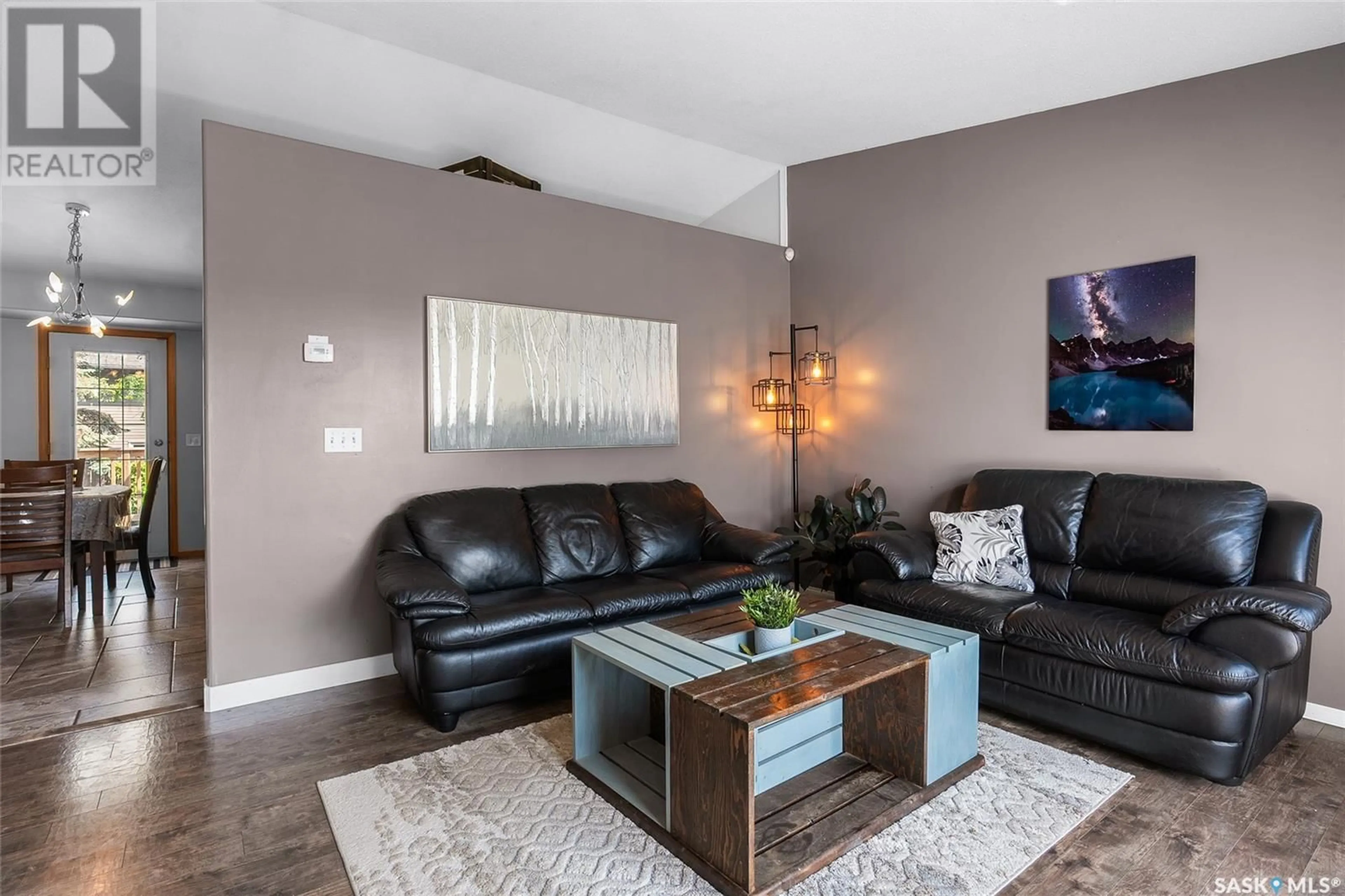 Living room with furniture, wood/laminate floor for 338 WEDGE ROAD, Saskatoon Saskatchewan S7L6G2