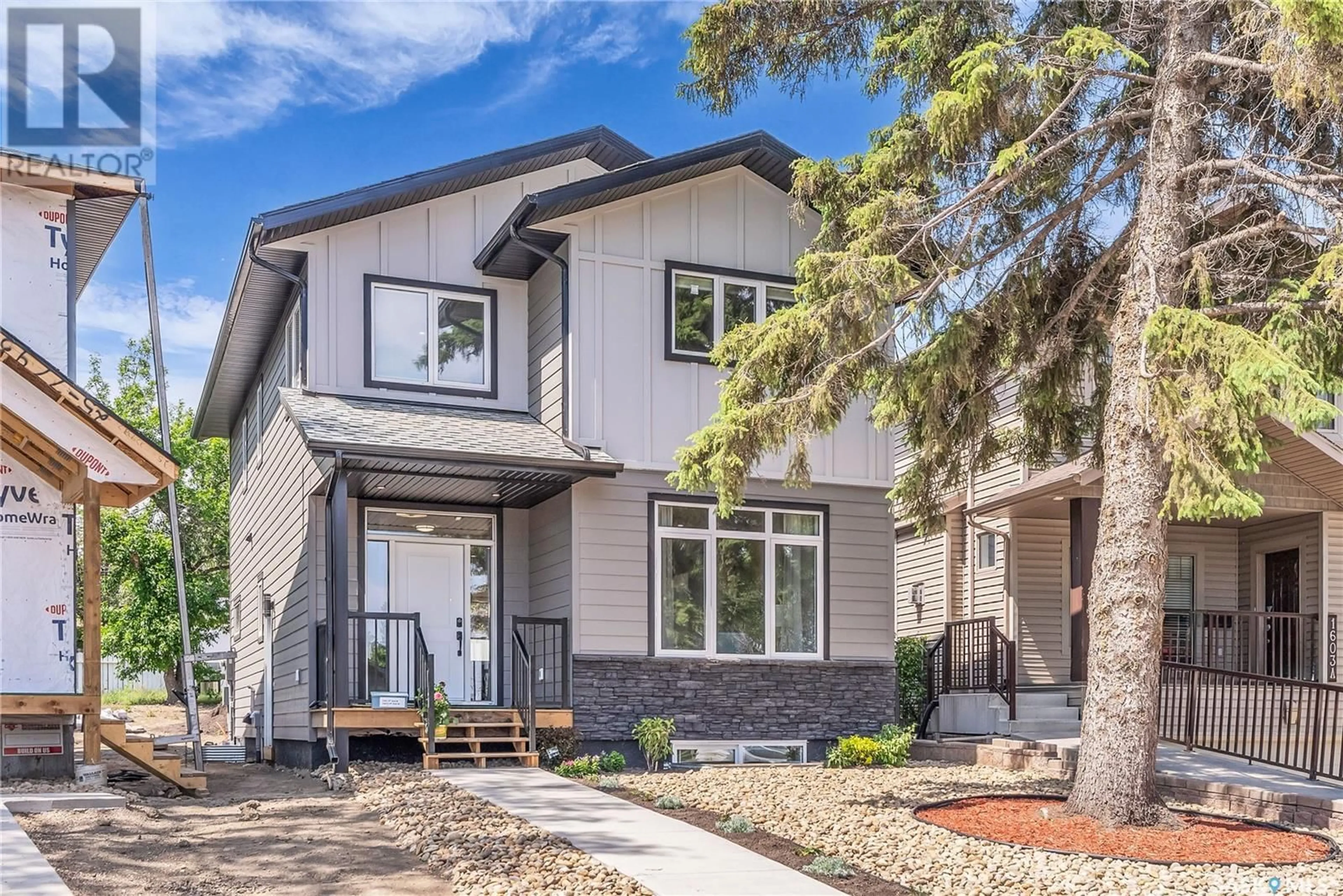 Home with brick exterior material, street for 1601b 9TH AVENUE, Saskatoon Saskatchewan S7K2Z9