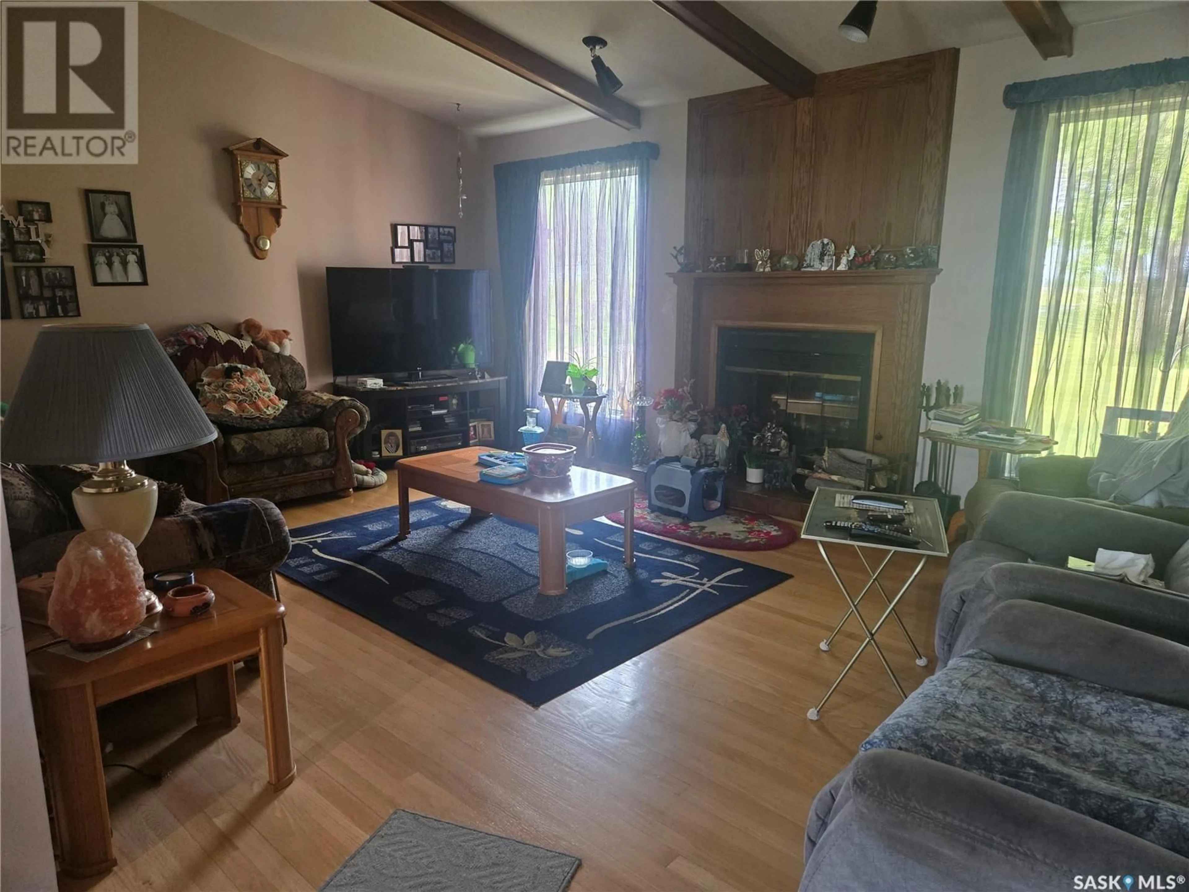 Living room with furniture, wood/laminate floor for VRANAI ACREAGE, Melville Saskatchewan S0A2P0