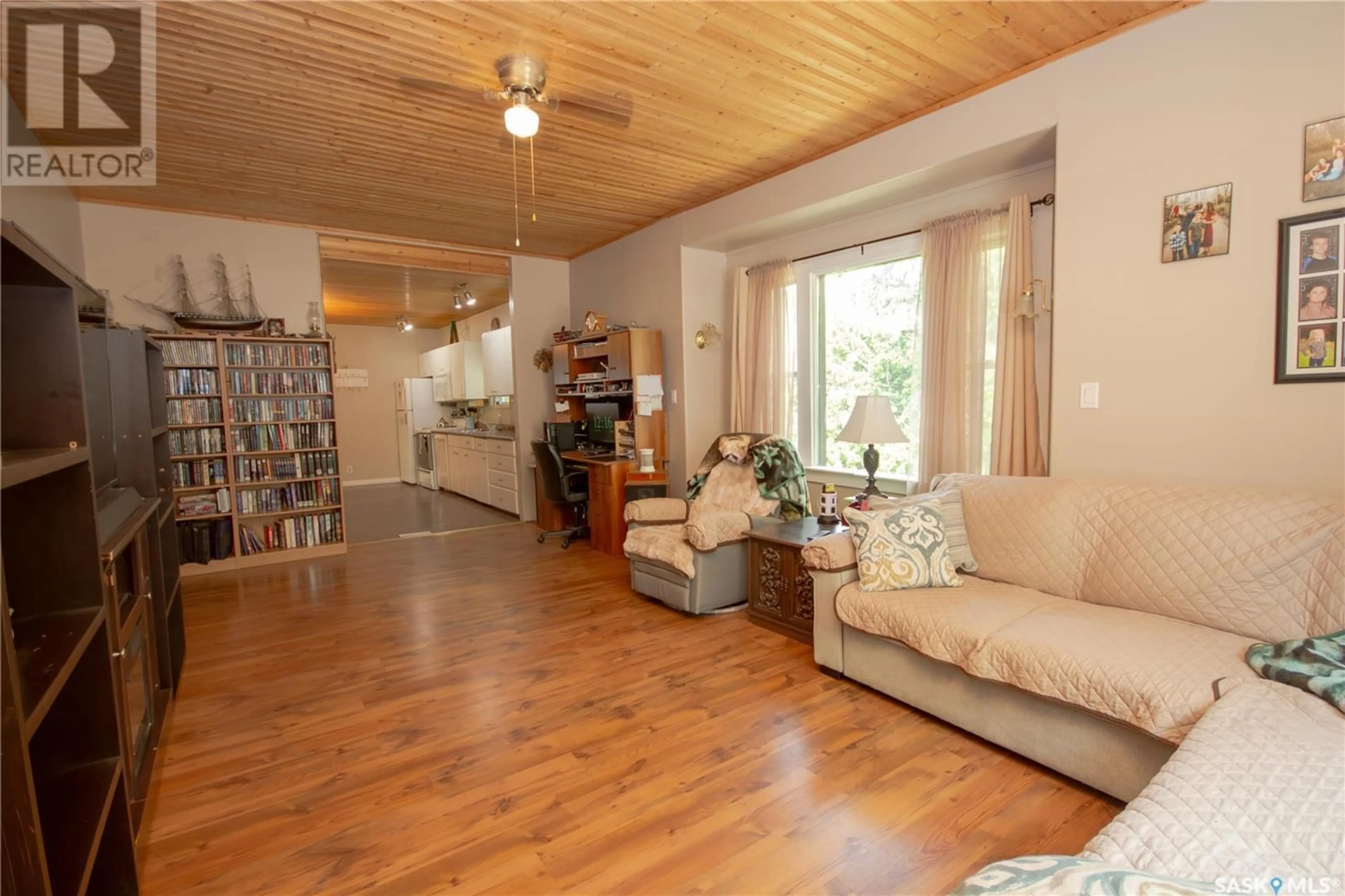 Living room with furniture, wood/laminate floor for 407 2ND STREET, Wilkie Saskatchewan S0K4W0