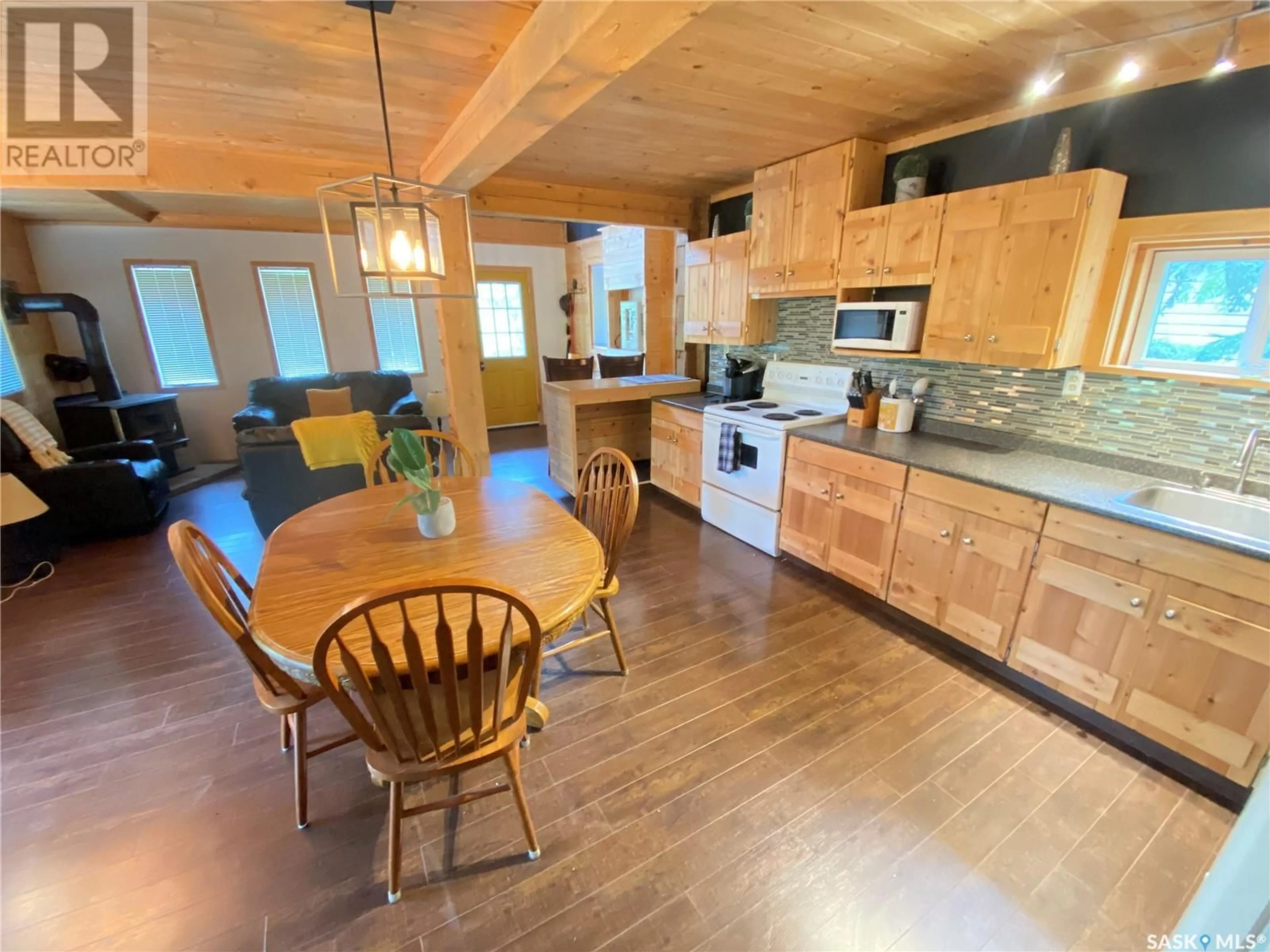 Open concept kitchen, wood/laminate floor for 201 GOVERNMENT ROAD, Good Spirit Lake Saskatchewan S0A1G0