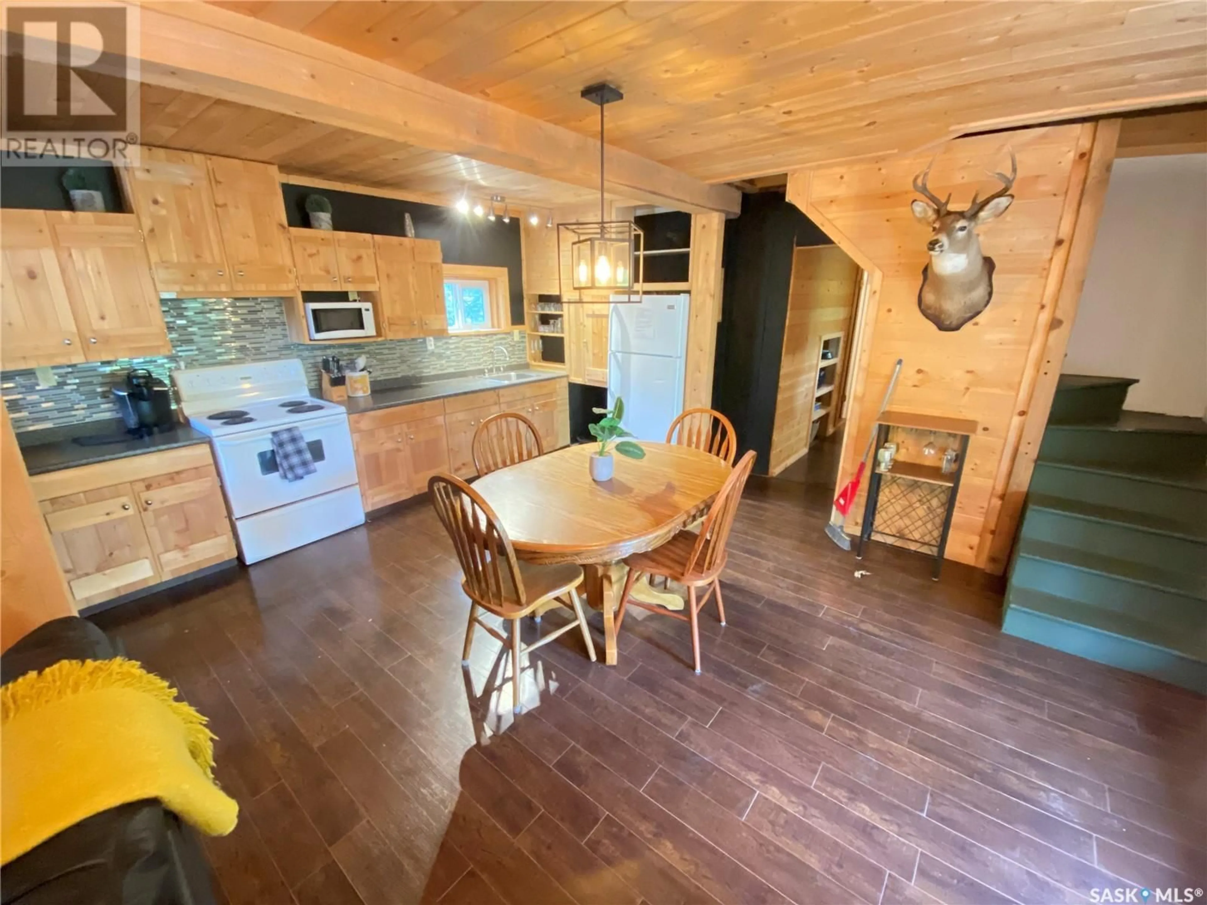 Open concept kitchen, wood/laminate floor for 201 GOVERNMENT ROAD, Good Spirit Lake Saskatchewan S0A1G0