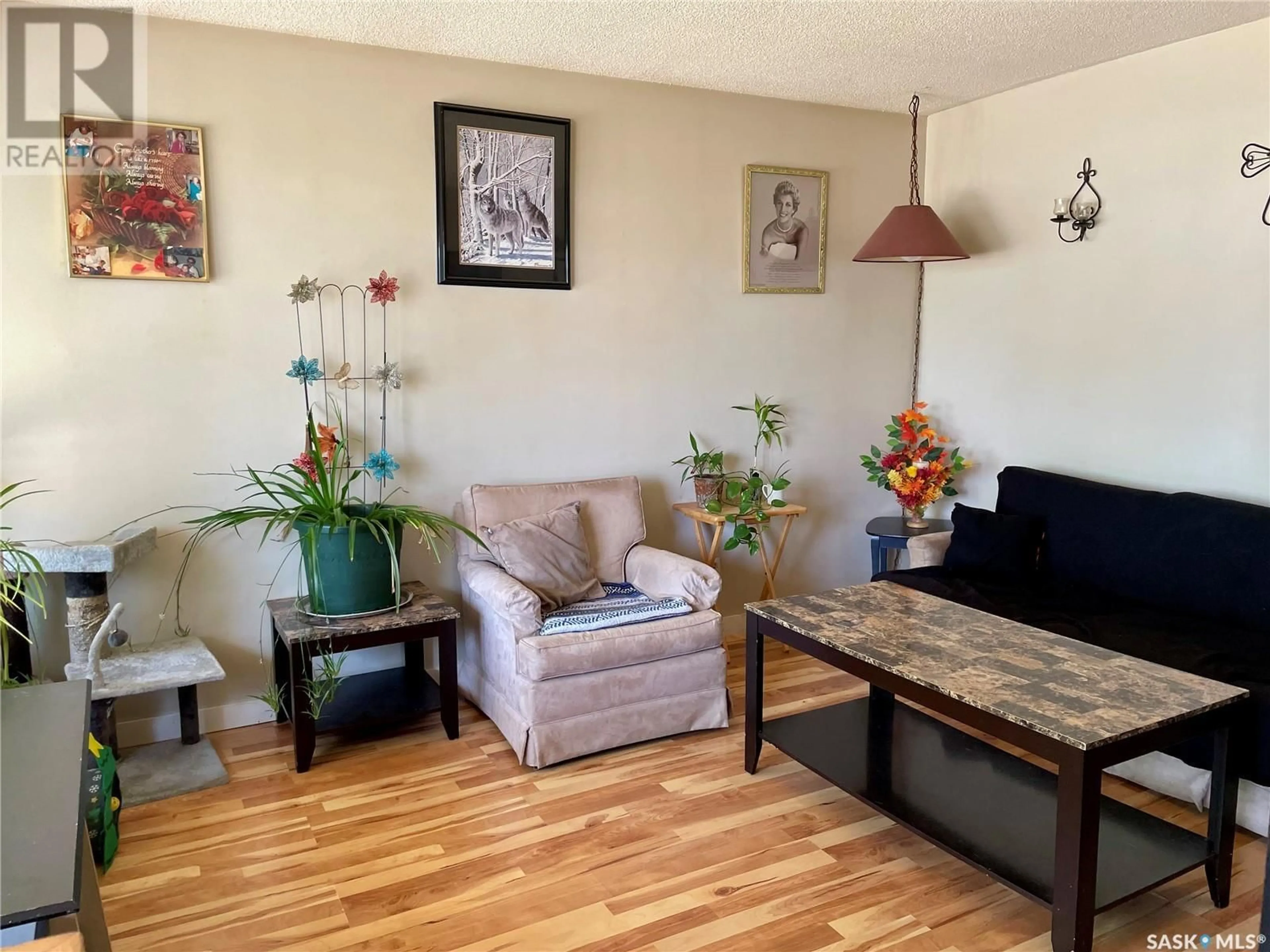 Living room with furniture, wood/laminate floor for 25 - 27 CUSHING CRESCENT, Regina Saskatchewan S4N1V2