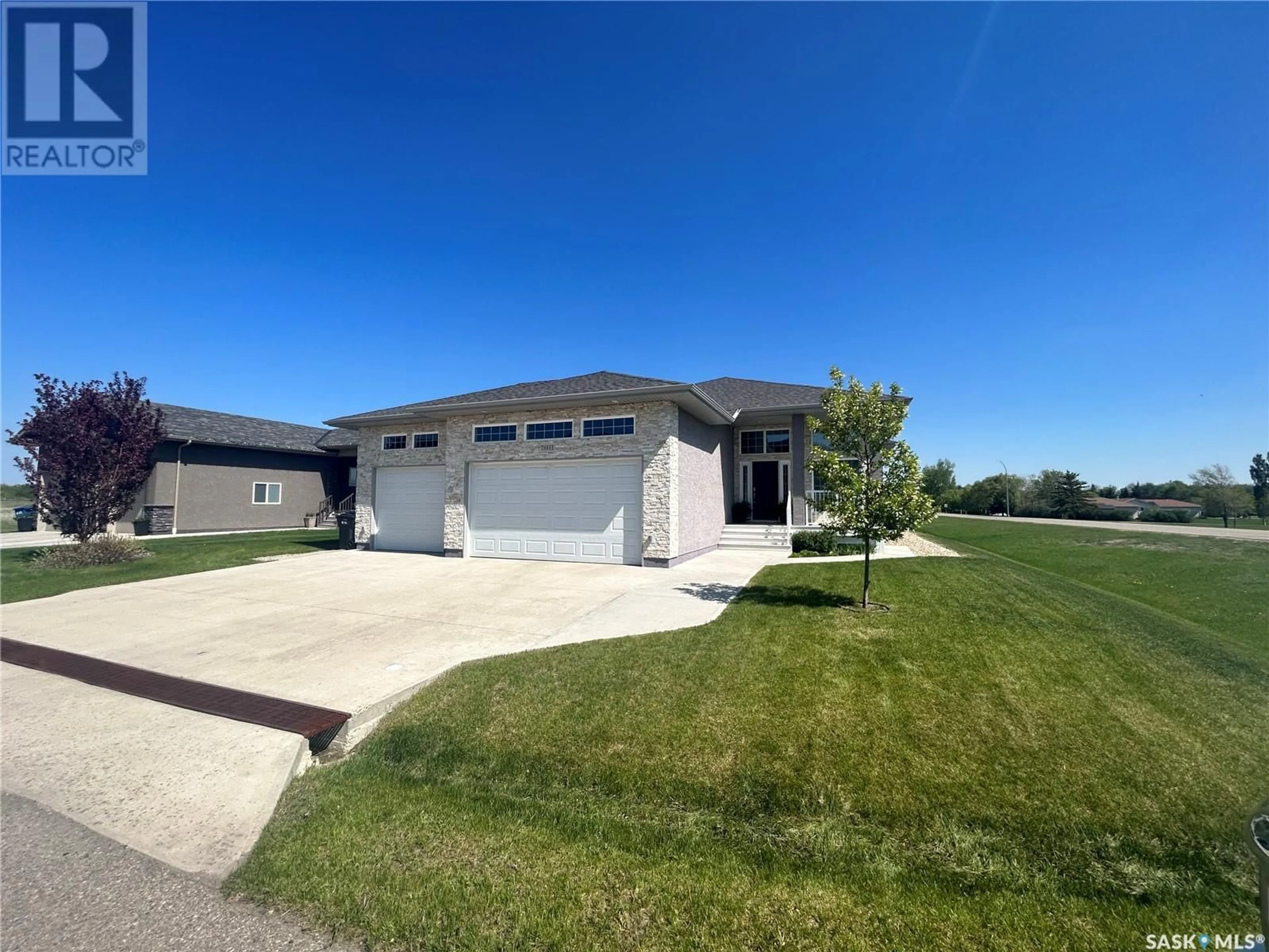 A pic from outside/outdoor area/front of a property/back of a property/a pic from drone, water/lake/river/ocean view for 3 MCKENZIE LANDING, White City Saskatchewan S4L0B2