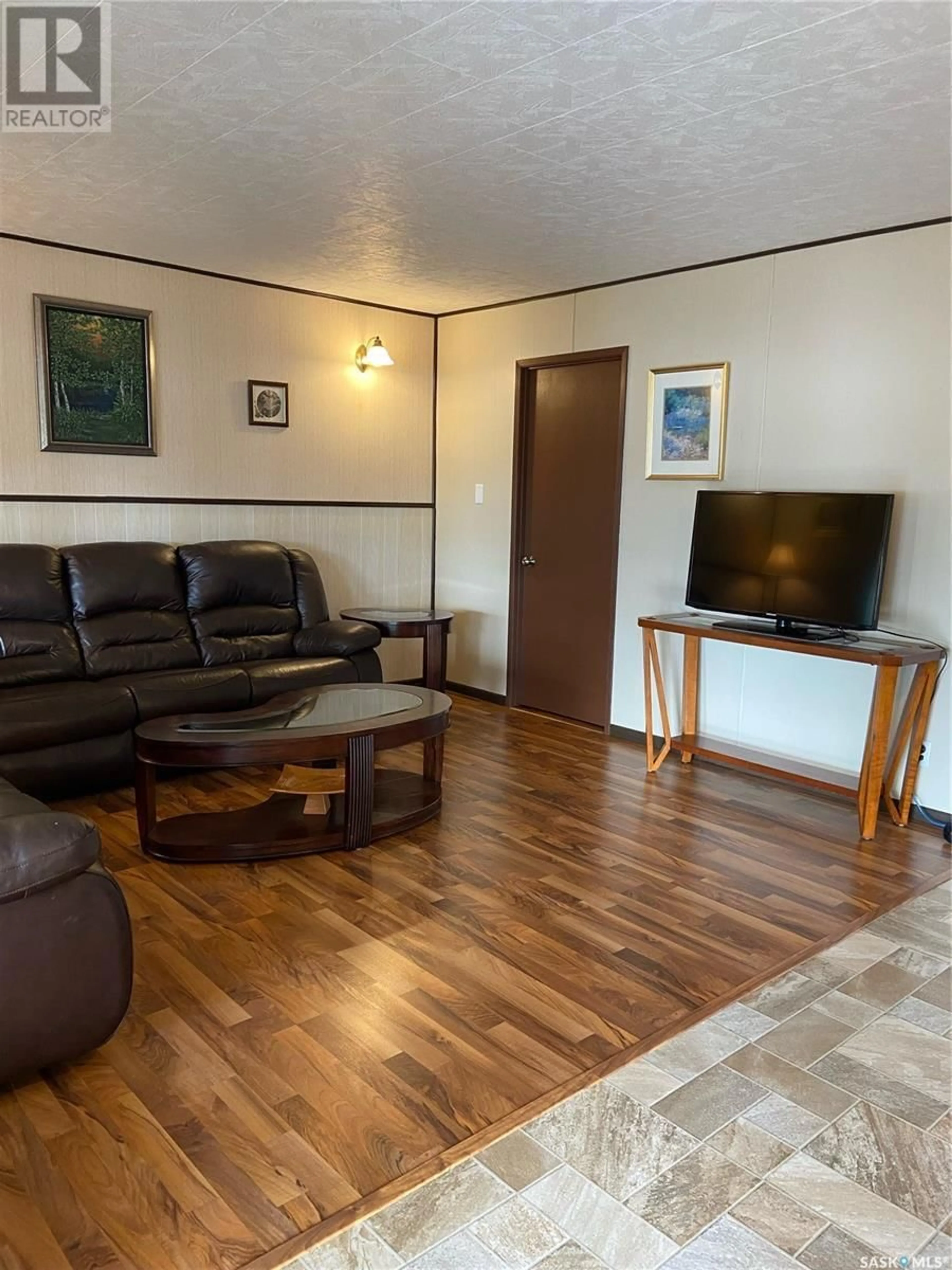 Living room with furniture, wood/laminate floor for LIANA'S LANE, Leask Rm No. 464 Saskatchewan S0J1M0