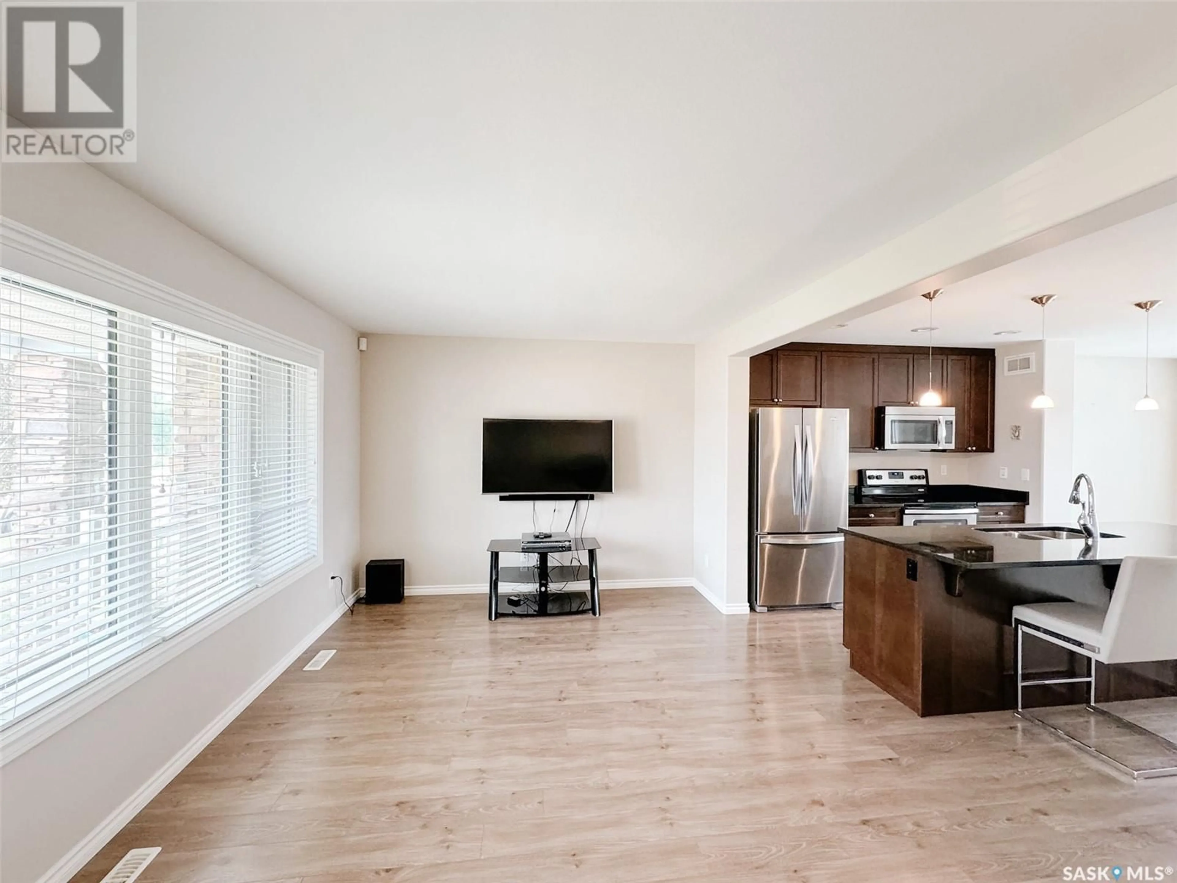 Open concept kitchen, wood/laminate floor for 1406 HUNTER ROAD, Saskatoon Saskatchewan S7T0T4
