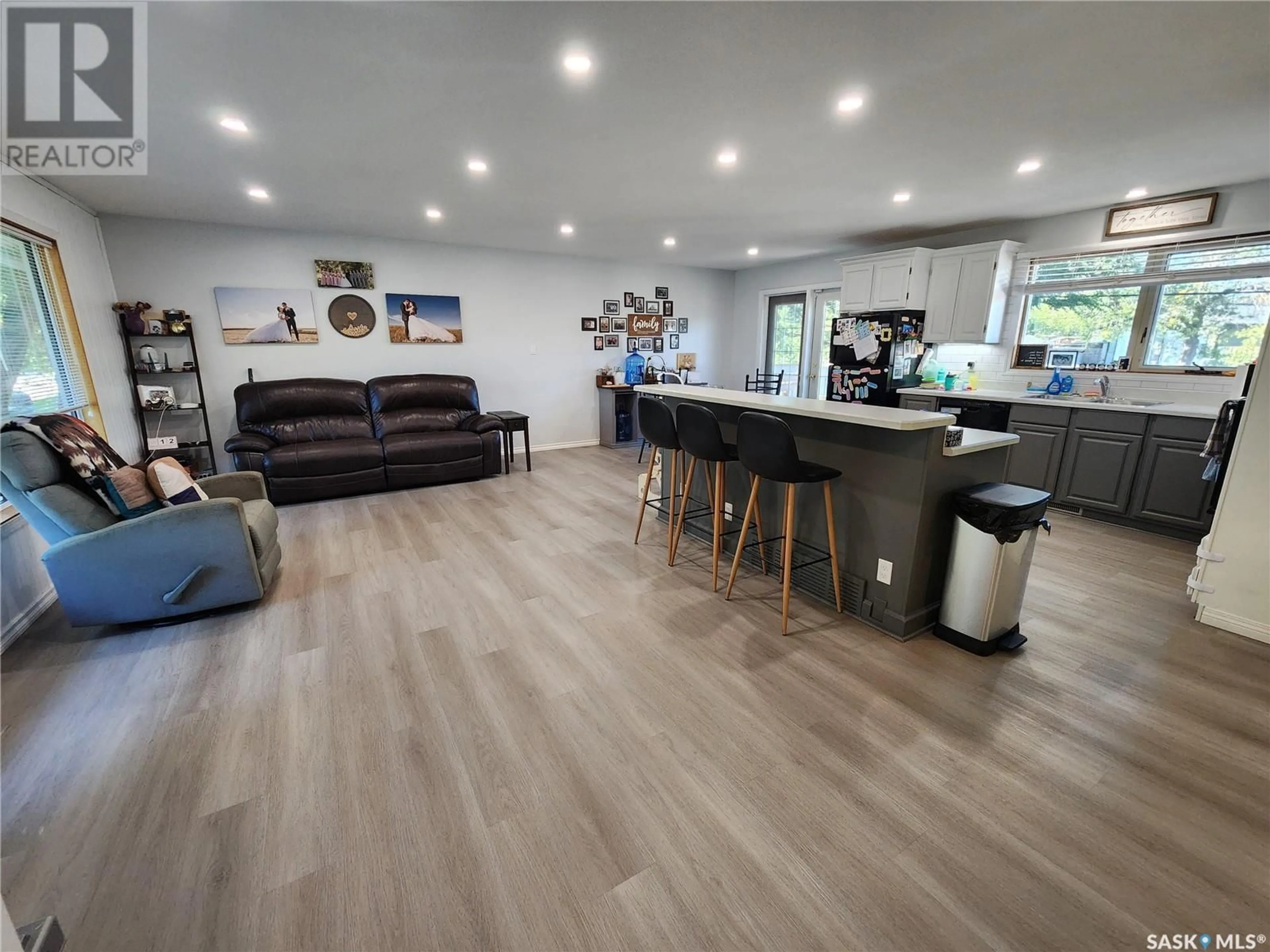 Open concept kitchen, wood/laminate floor for 254 DUNCAN ROAD, Estevan Saskatchewan S4A0A4