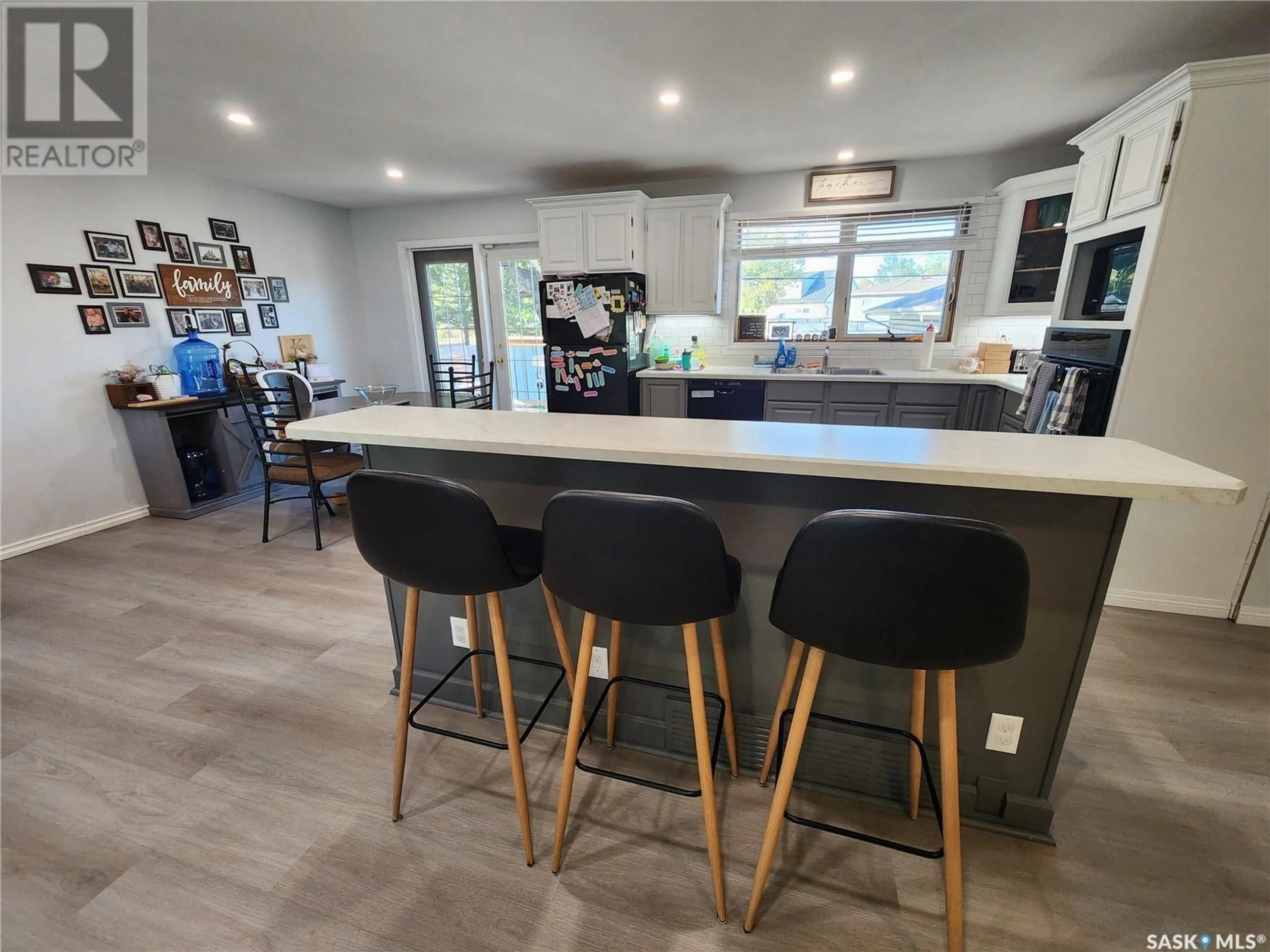 Open concept kitchen, wood/laminate floor for 254 DUNCAN ROAD, Estevan Saskatchewan S4A0A4