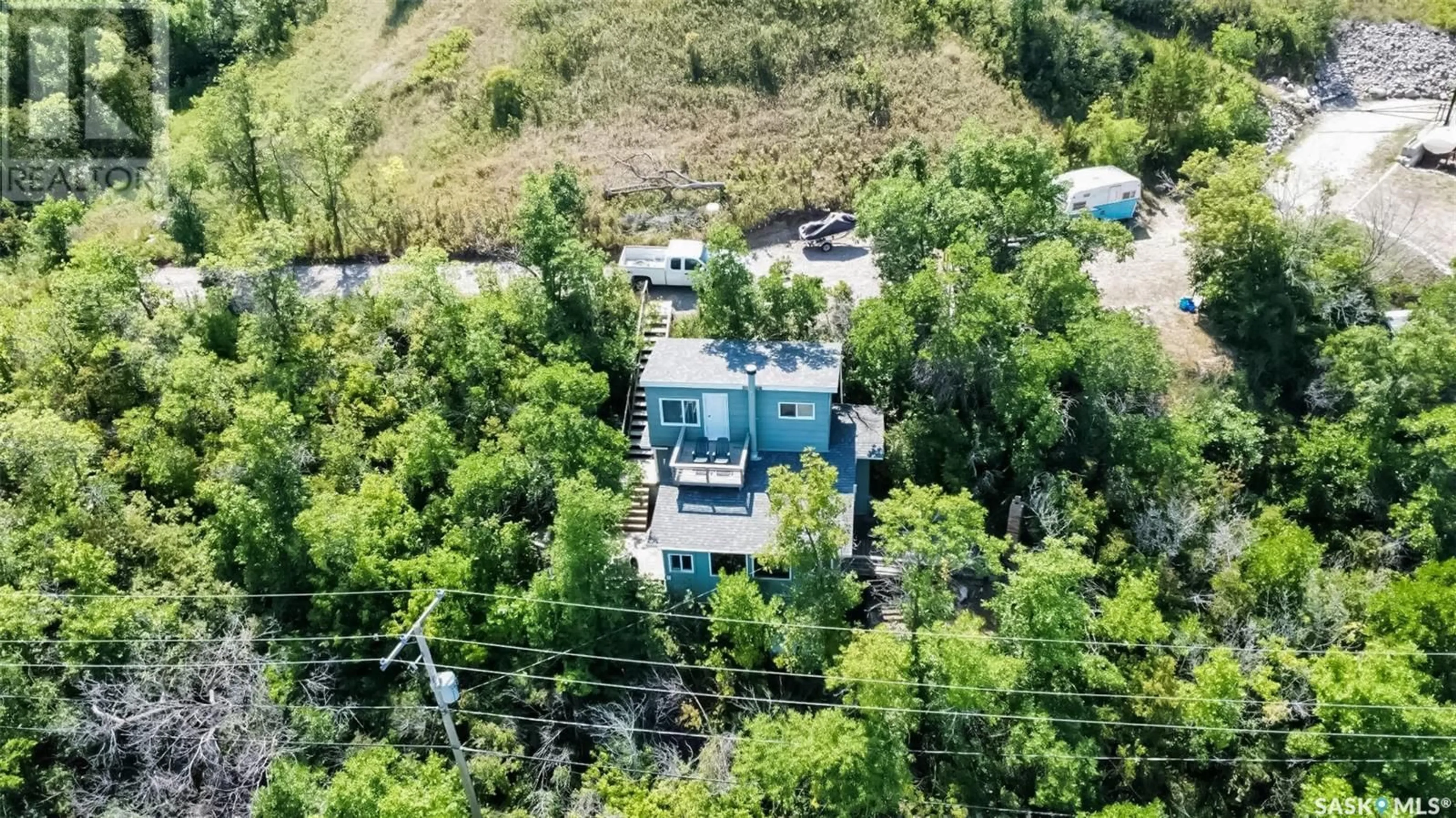 A pic from outside/outdoor area/front of a property/back of a property/a pic from drone, mountain view for 119 B-SAY-TAH ROAD, B-Say-Tah Saskatchewan S0G1S0