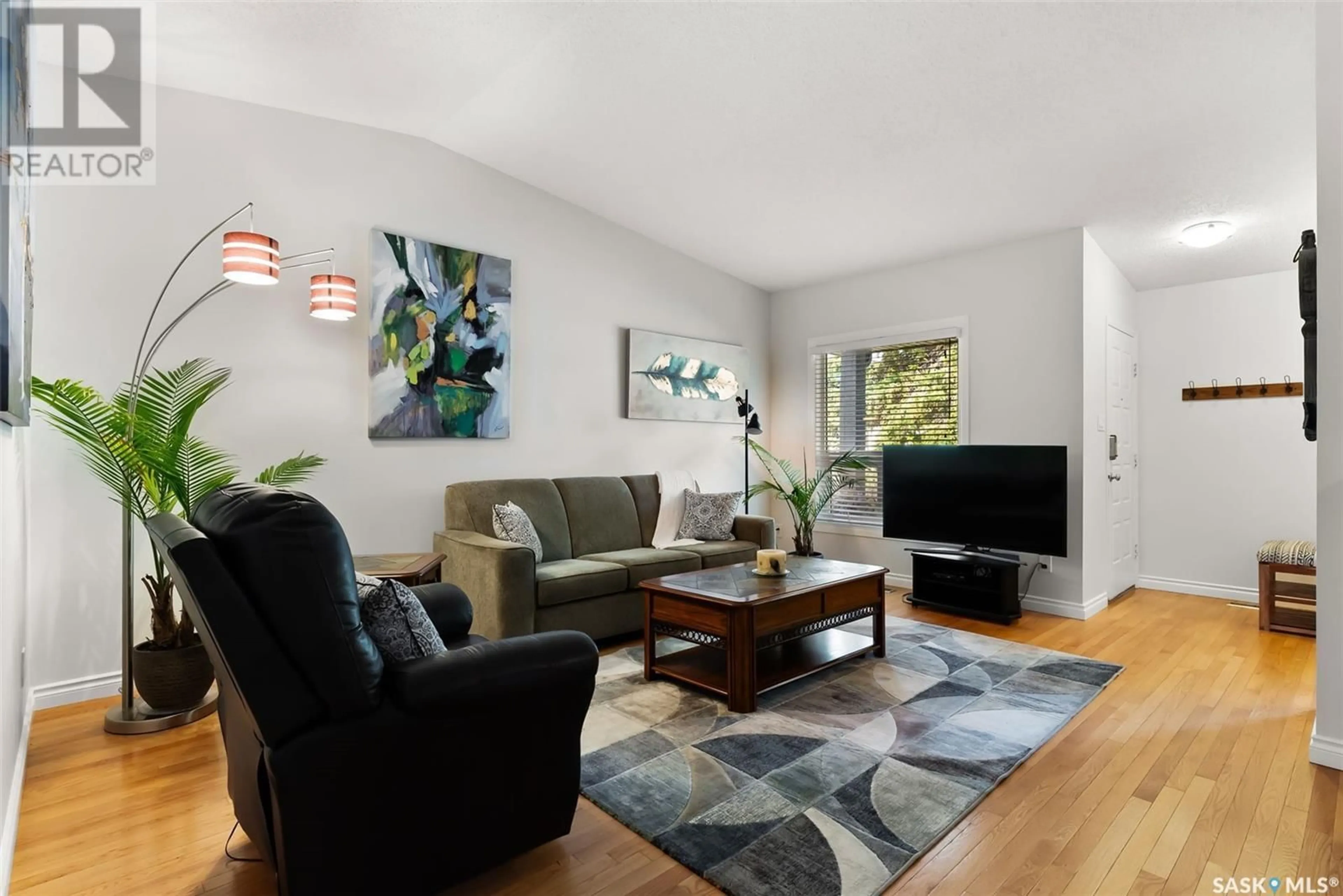 Living room with furniture, wood/laminate floor for 2756 MEADOW LANE, Regina Saskatchewan S4V1L6