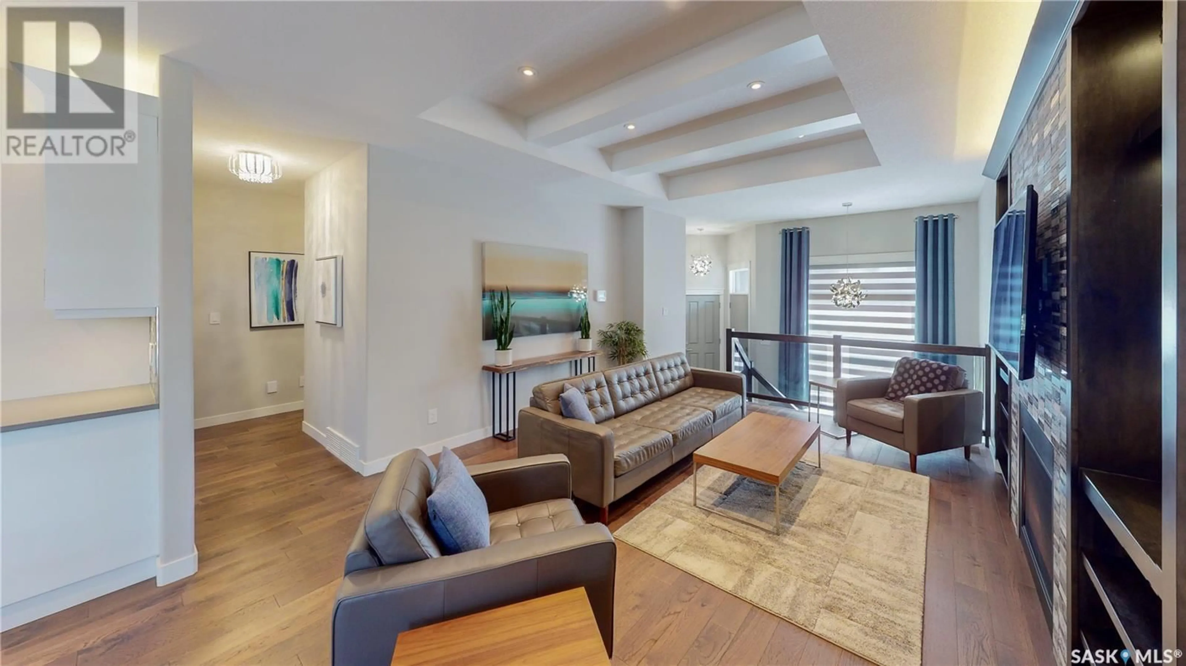 Living room with furniture, wood/laminate floor for 3626 GREEN CREEK ROAD, Regina Saskatchewan S4V3H3