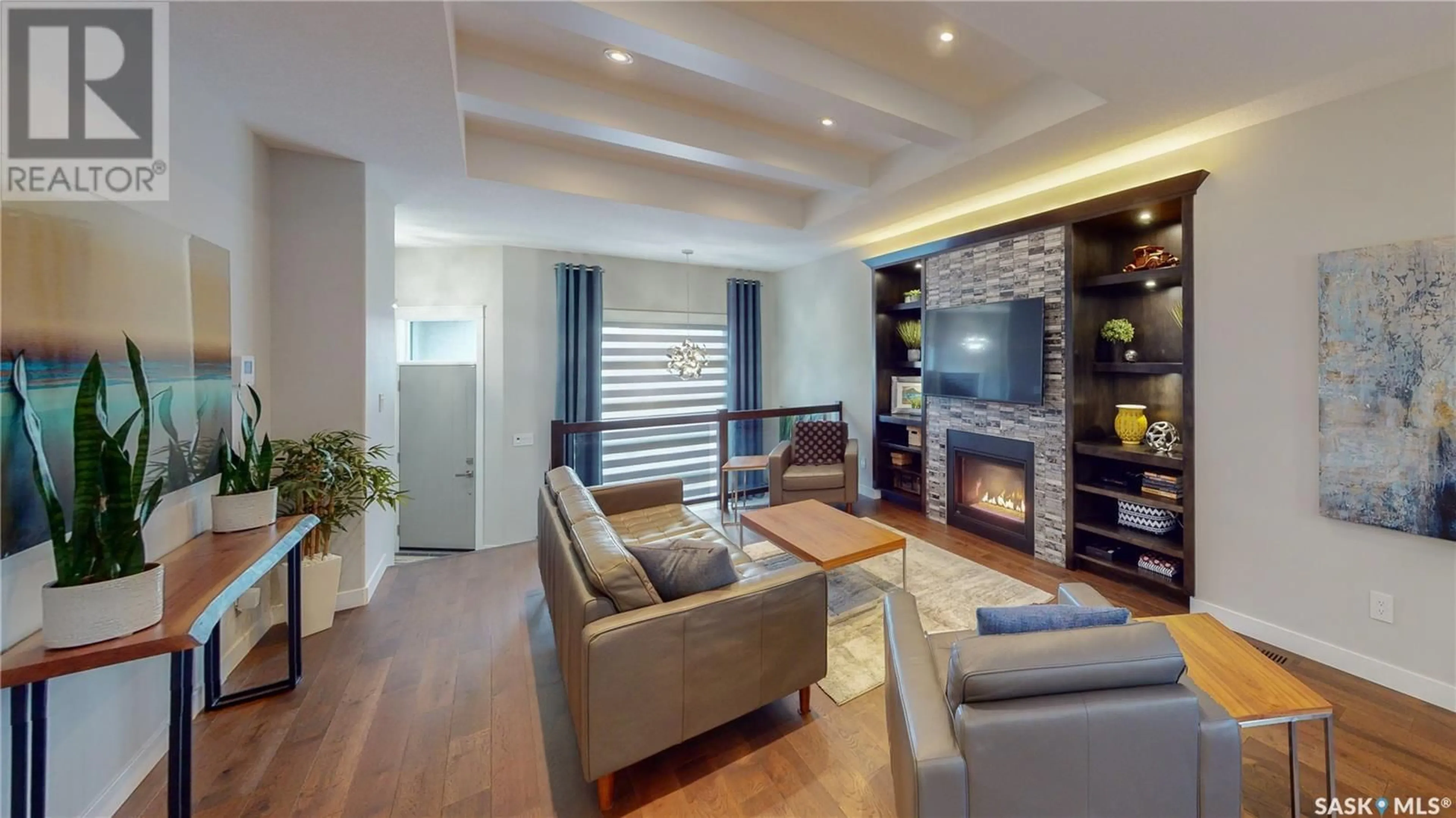 Living room with furniture, wood/laminate floor for 3626 GREEN CREEK ROAD, Regina Saskatchewan S4V3H3