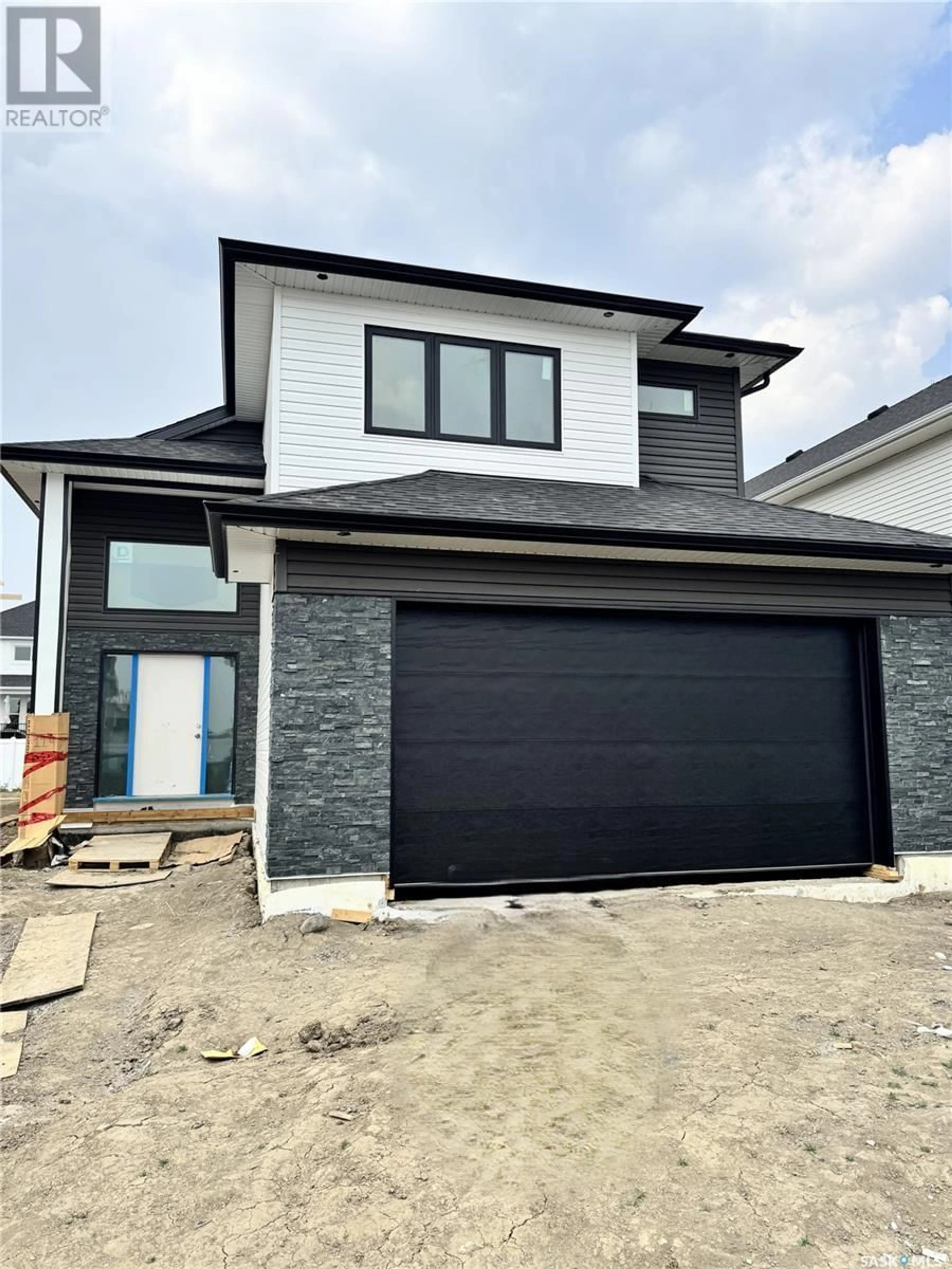 Home with brick exterior material, street for 114 HAVERSTOCK CRESCENT, Saskatoon Saskatchewan S7W1E2