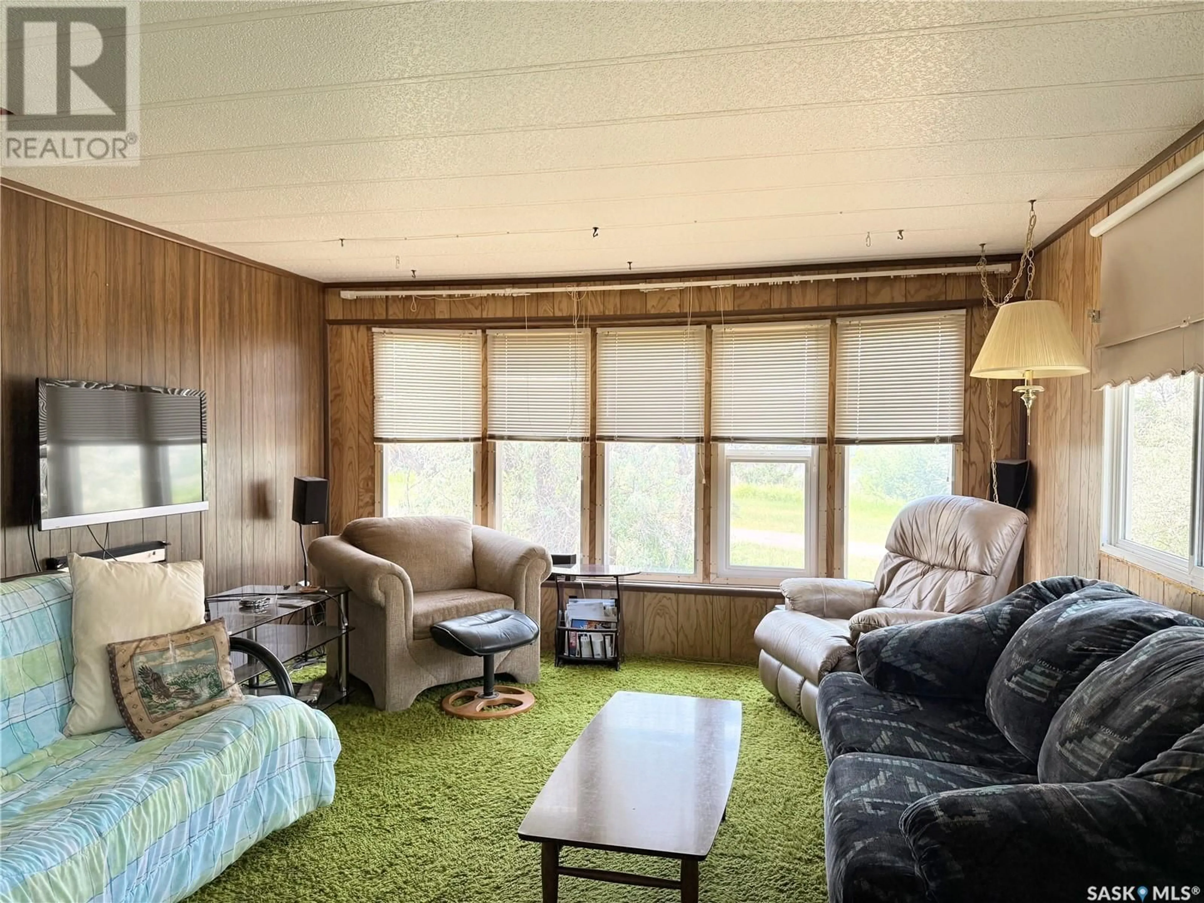 Living room with furniture, wood/laminate floor for 525 PARK AVENUE, Outlook Saskatchewan S0L2N0