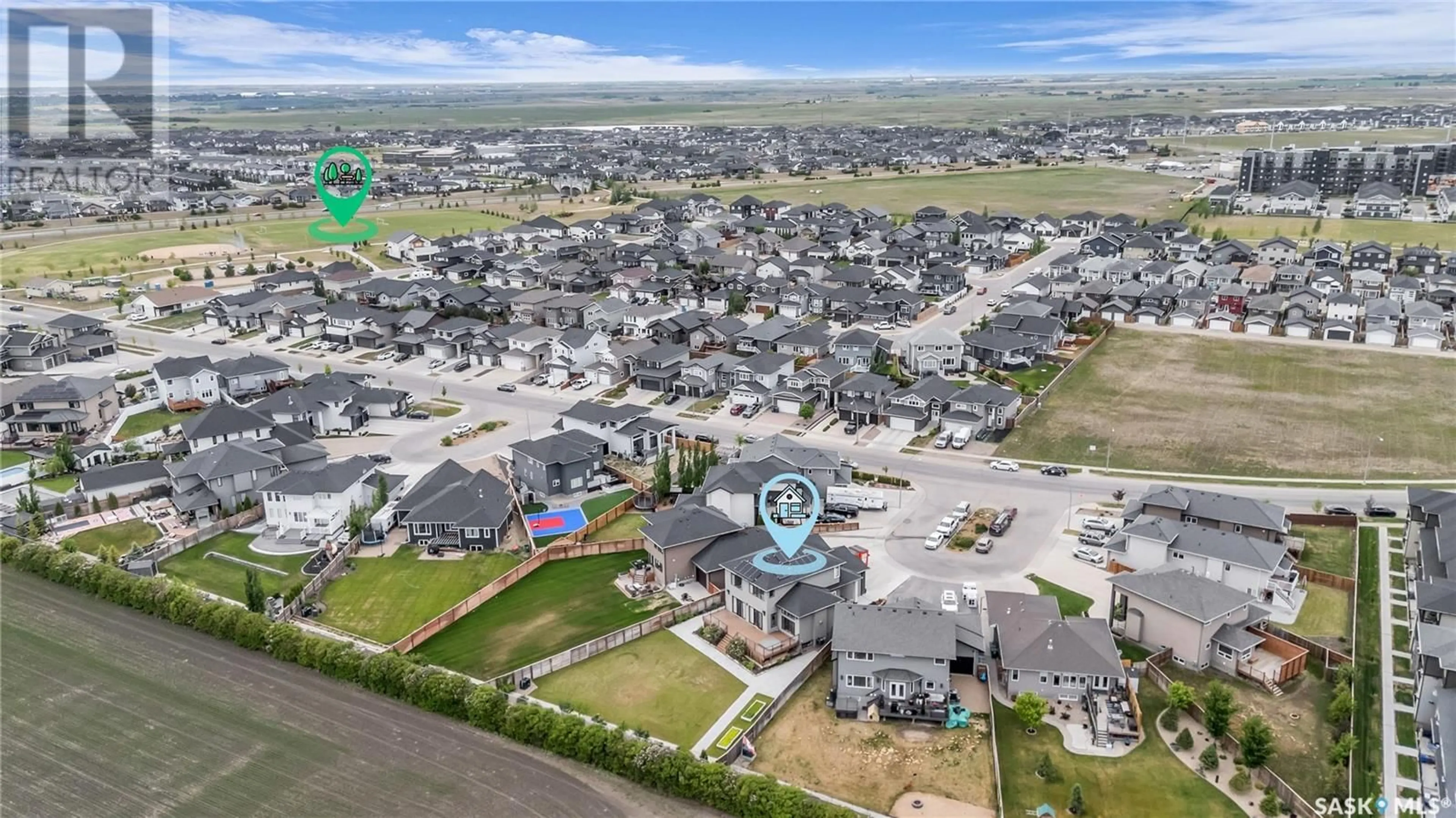 A pic from outside/outdoor area/front of a property/back of a property/a pic from drone, street for 516 BALTZAN BAY, Saskatoon Saskatchewan S7W0S1