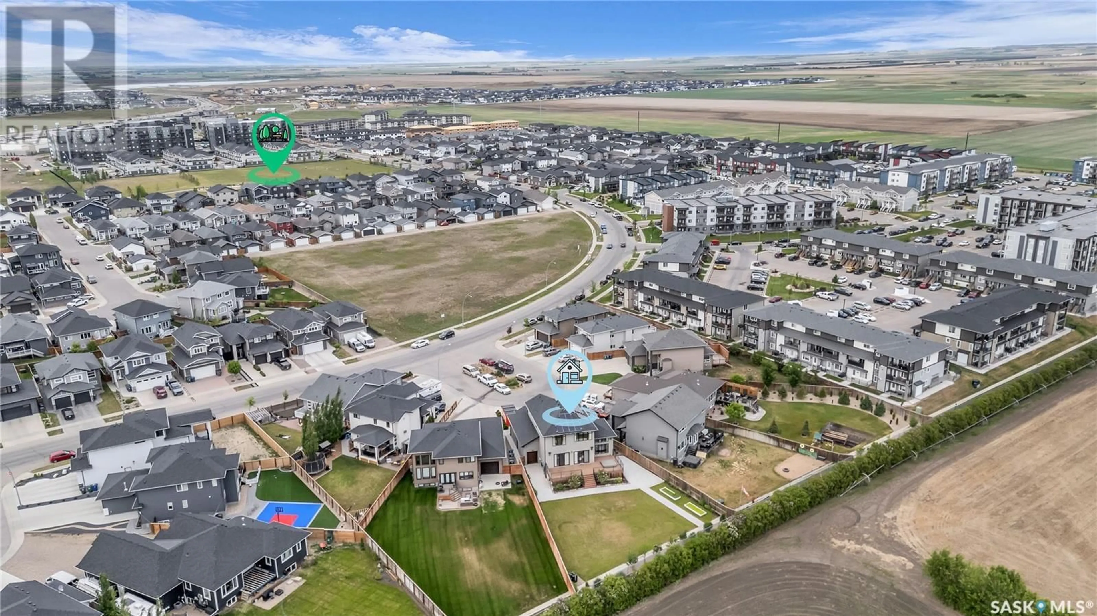A pic from outside/outdoor area/front of a property/back of a property/a pic from drone, mountain view for 516 BALTZAN BAY, Saskatoon Saskatchewan S7W0S1