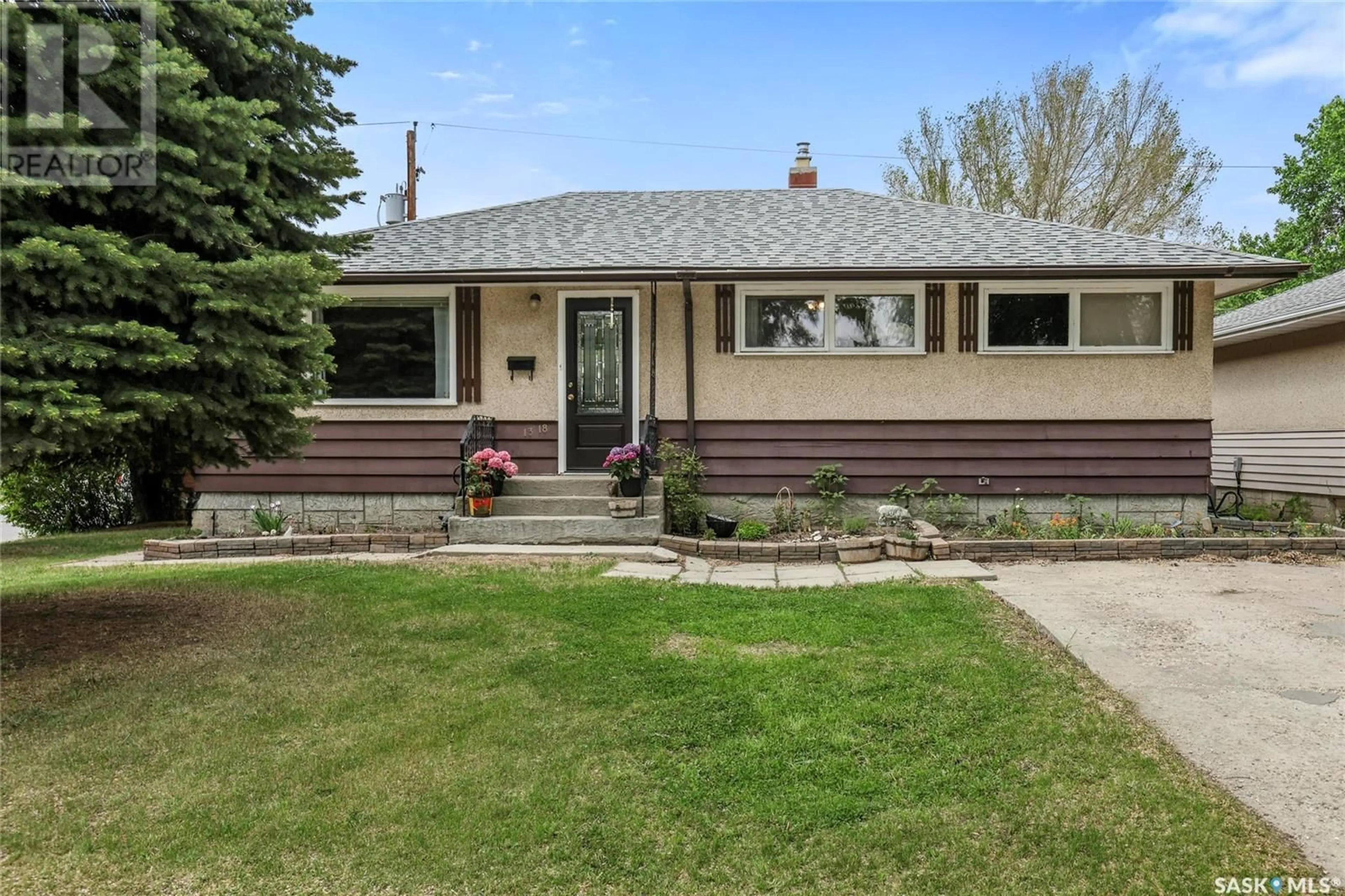 Home with vinyl exterior material, street for 1318 7TH AVENUE, Regina Saskatchewan S4R0H4