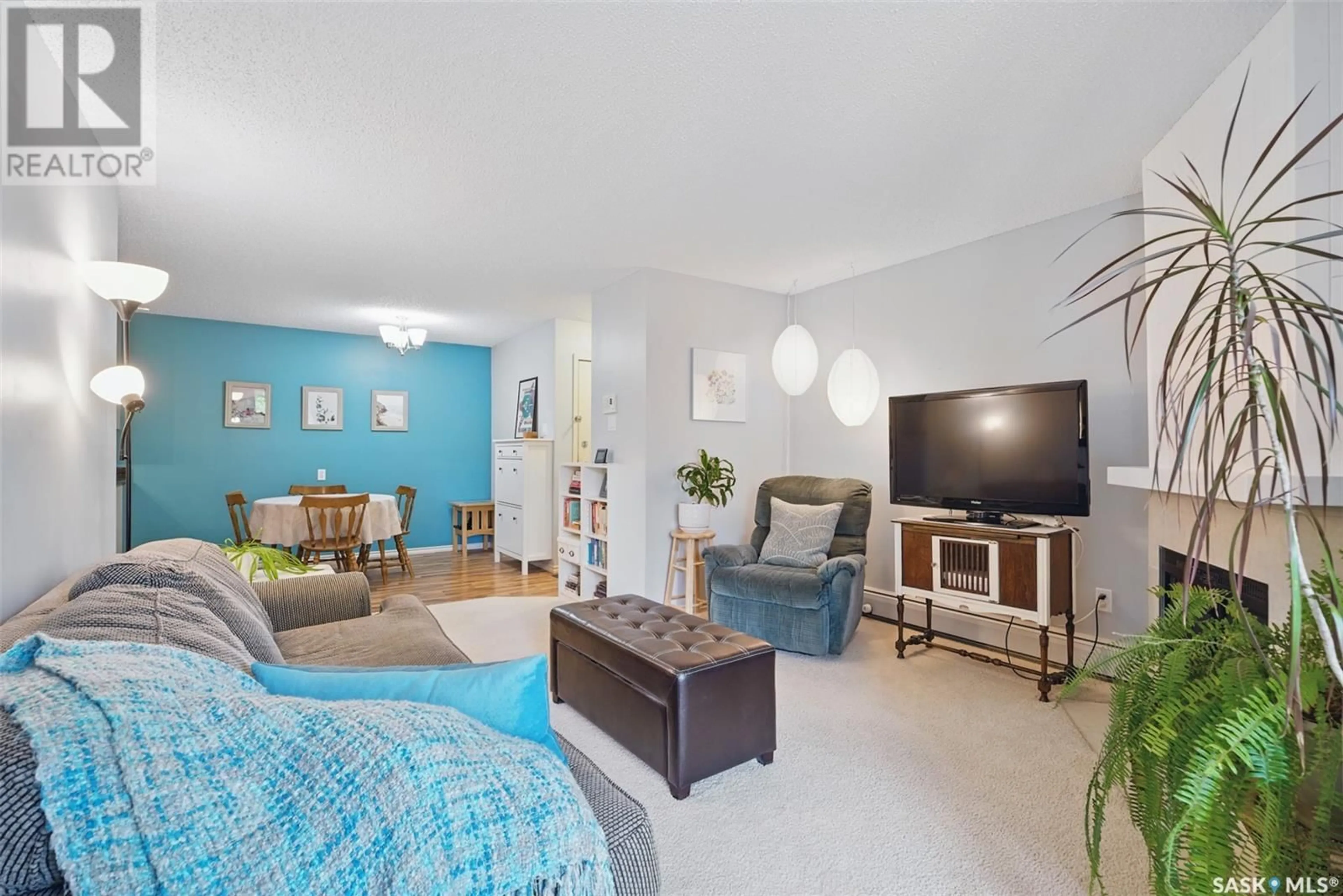 Living room with furniture, unknown for 206H - 1121 MCKERCHER DRIVE, Saskatoon Saskatchewan S7H5B8
